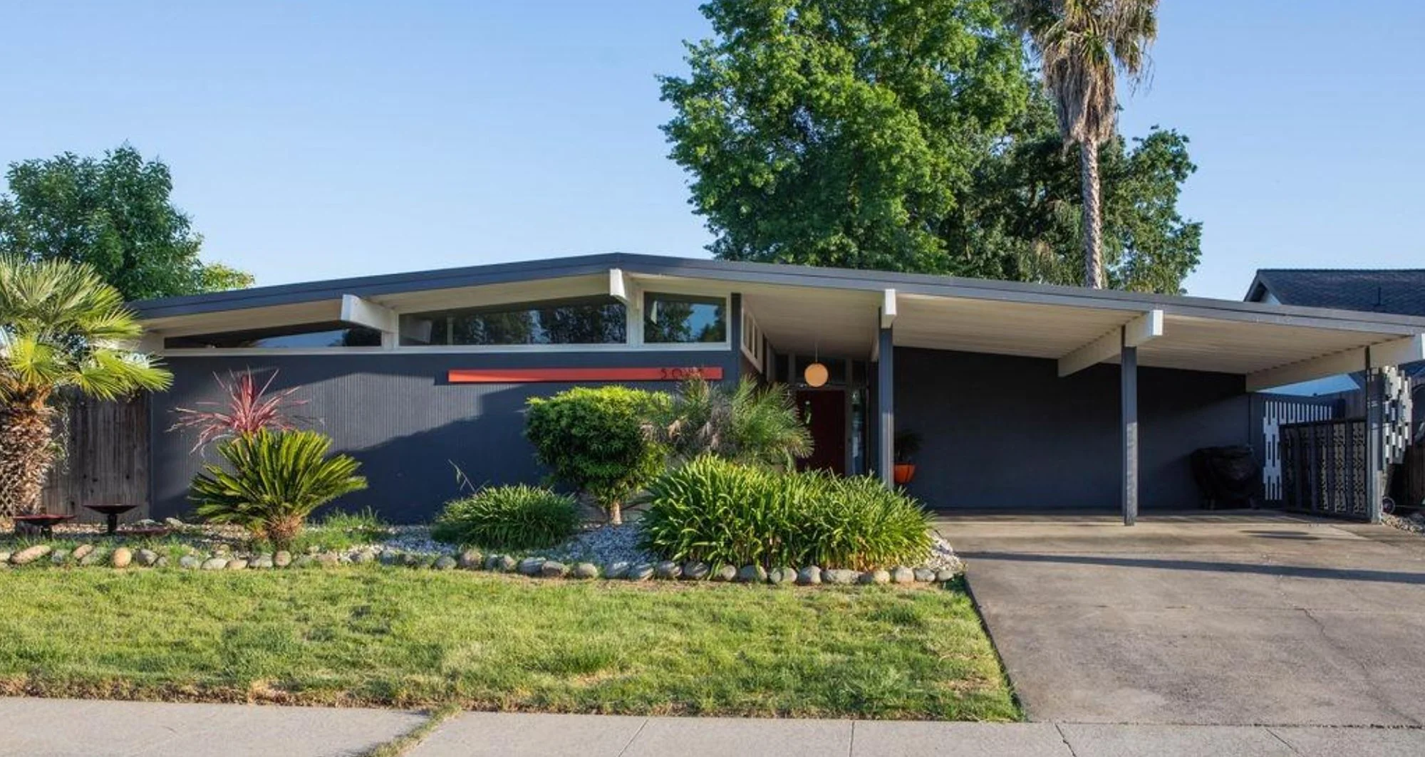 Blue Streng Bros mid century modern home with palm tree