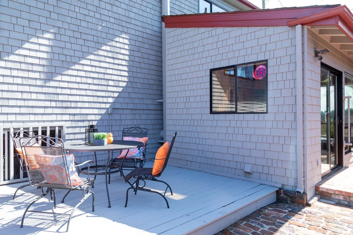 Patio with outdoor dining table and chairs.