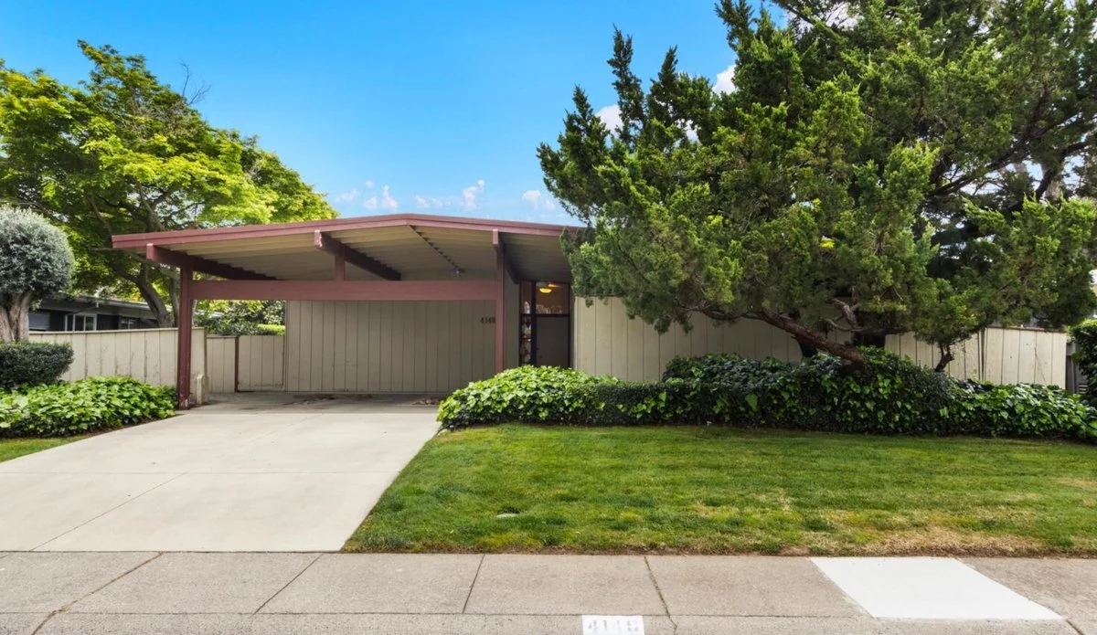 MCM Home with carport. Green grass in front yard. Streng bros design. Carter Sparks.