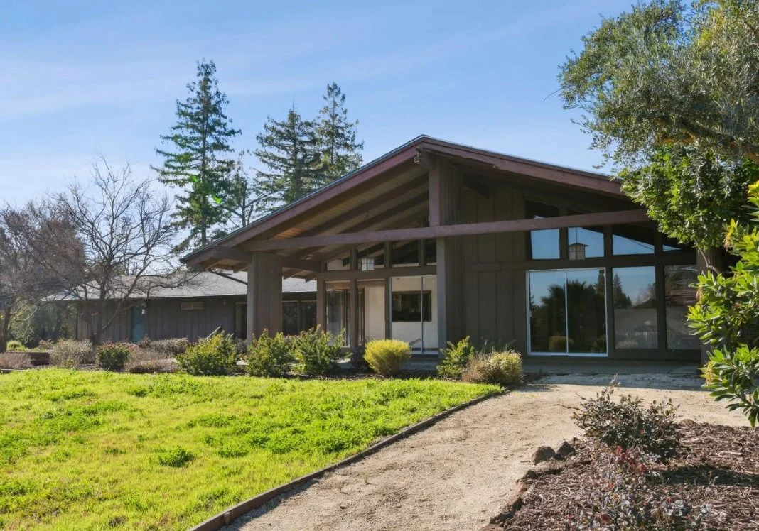 Vaulted ceilings back yard entry on mid century modern home.