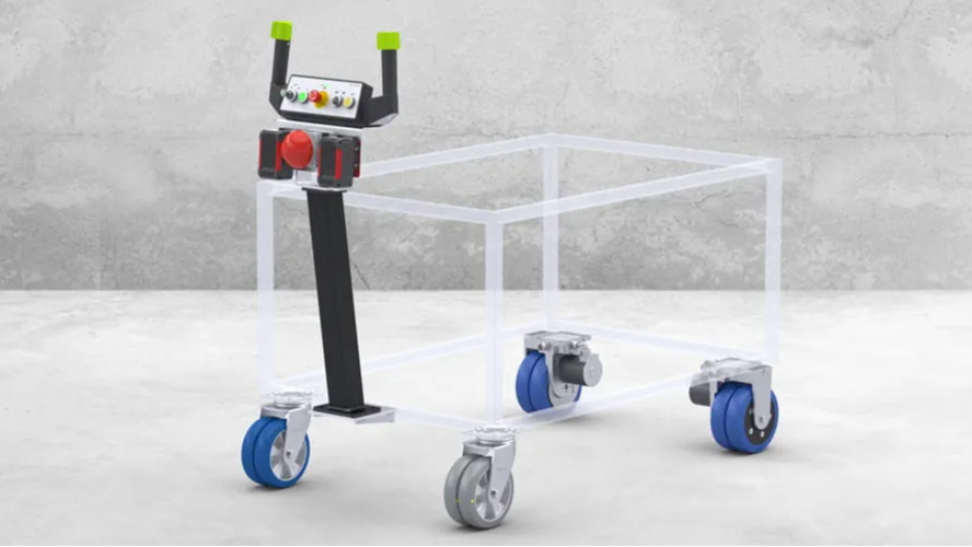 A remote-controlled robot with a control handle and a transparent frame with four blue caster wheels standing on a concrete floor against a gray wall.