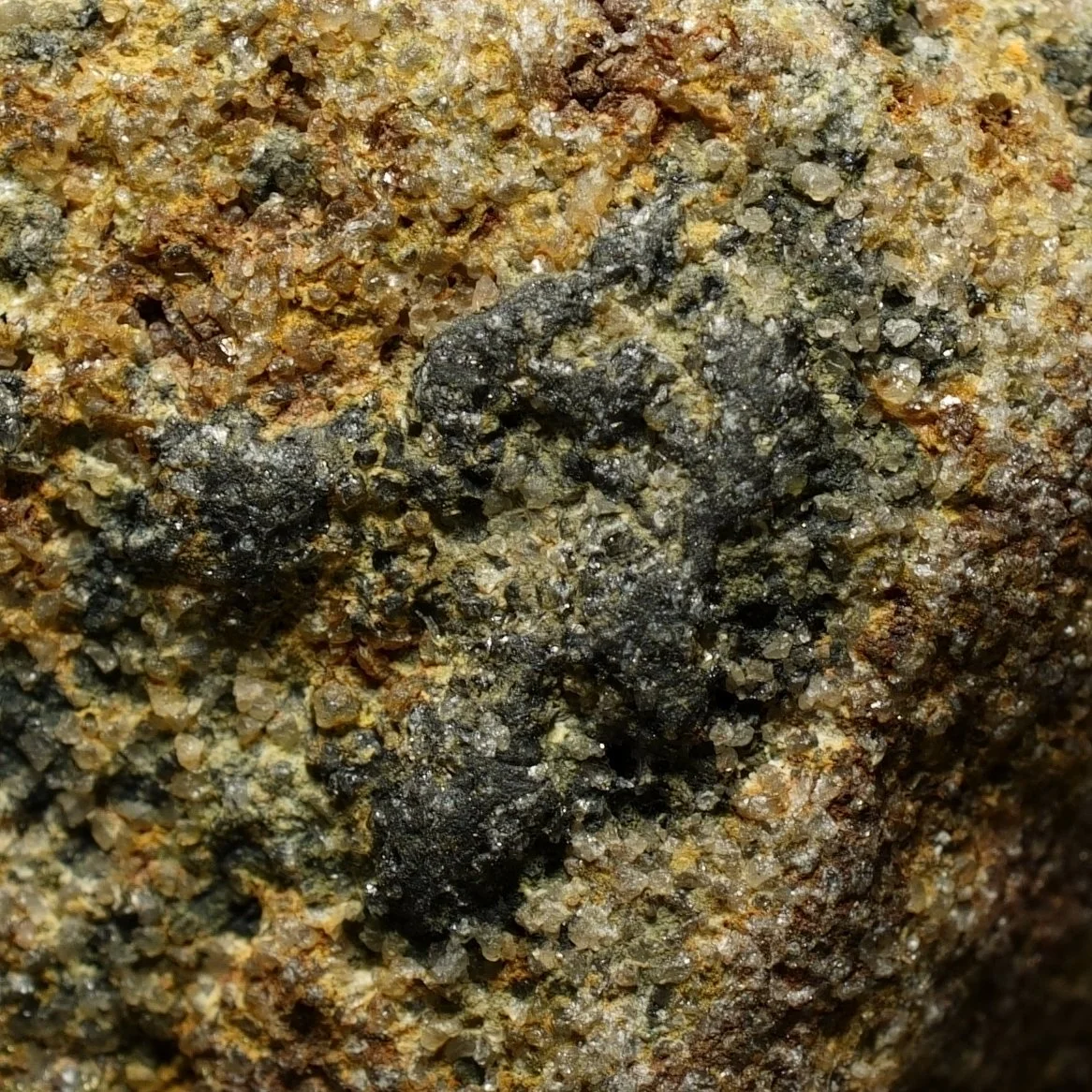Uraninite uranium ore embedded in quartz matrix with iron staining high activity radioactive mineral specimen