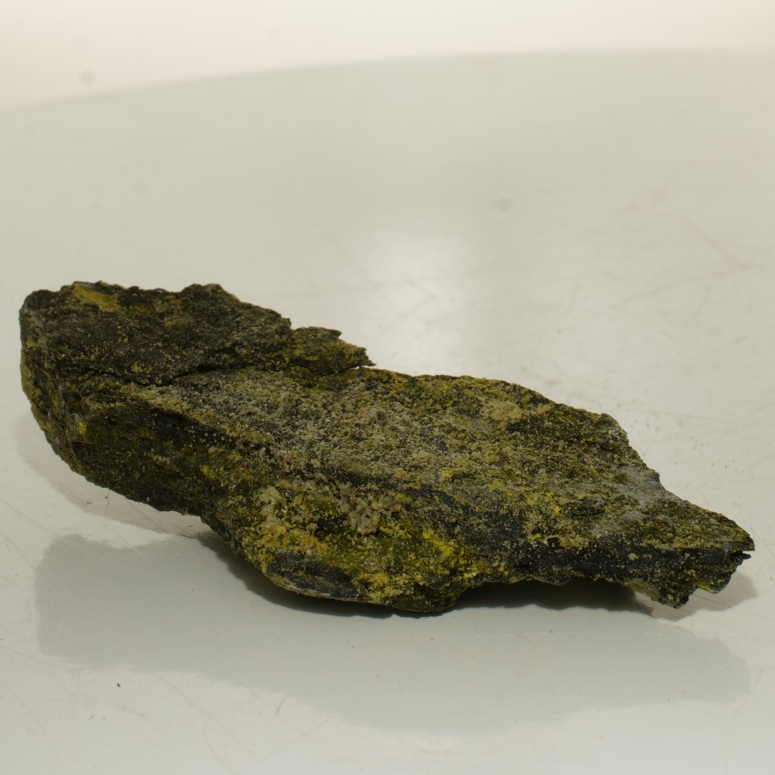High-grade uranium ore specimen from Green River Utah with yellow secondary mineralization emitting 50,000 CPM