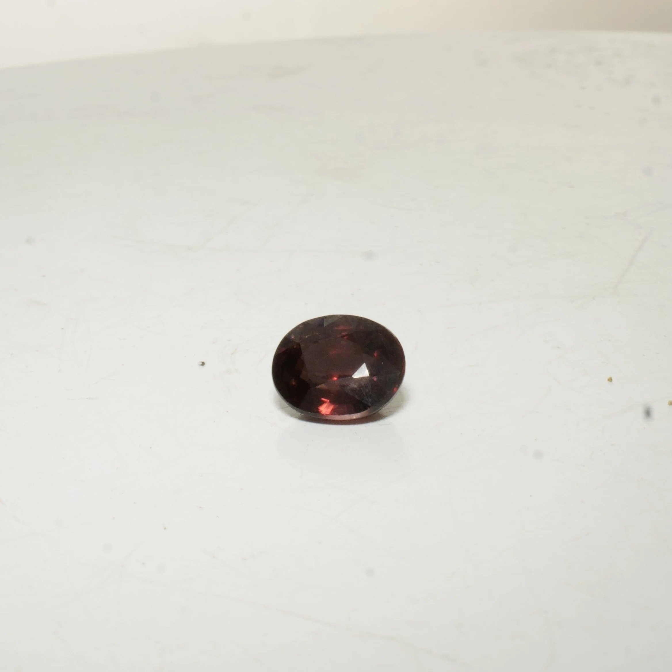 Natural untreated red zircon gemstone, oval faceted cut, 4.5 carats, 10 by 8 by 5 millimeters, VVS clarity.