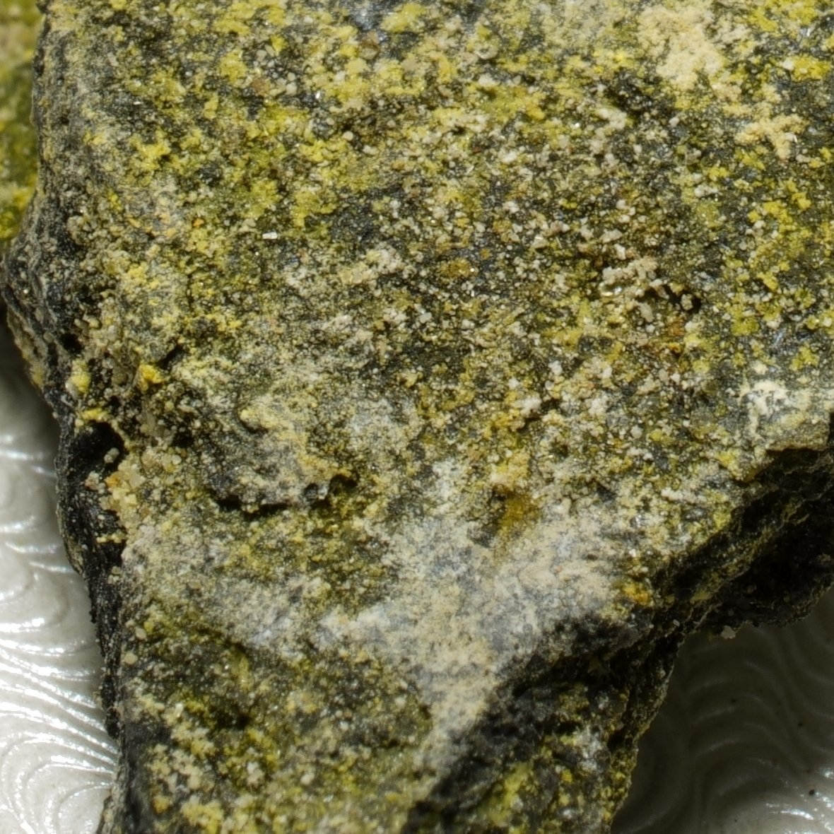 High-grade uranium ore specimen from Green River Utah with yellow secondary mineralization emitting 50,000 CPM