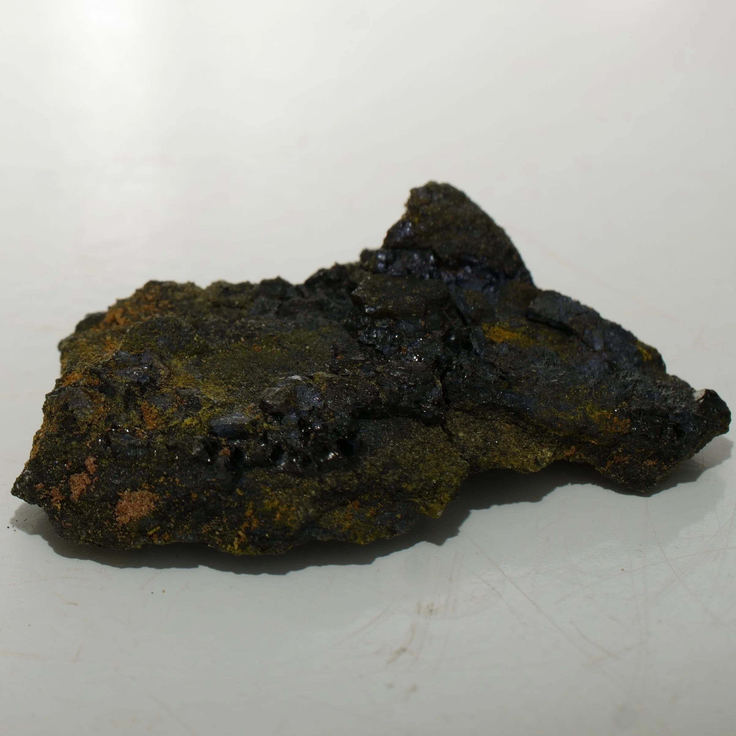 Micro uranium ore specimen from Cottonwood Wash Utah with dark uraninite-rich material emitting 30,000 CPM