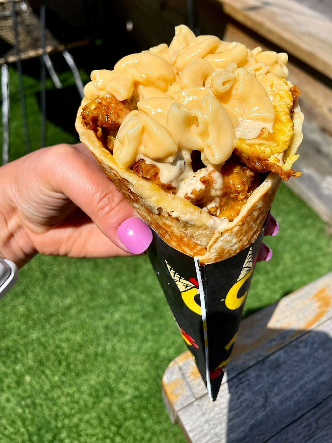 Coneheads chicken and macaroni and cheese served in a waffle cone