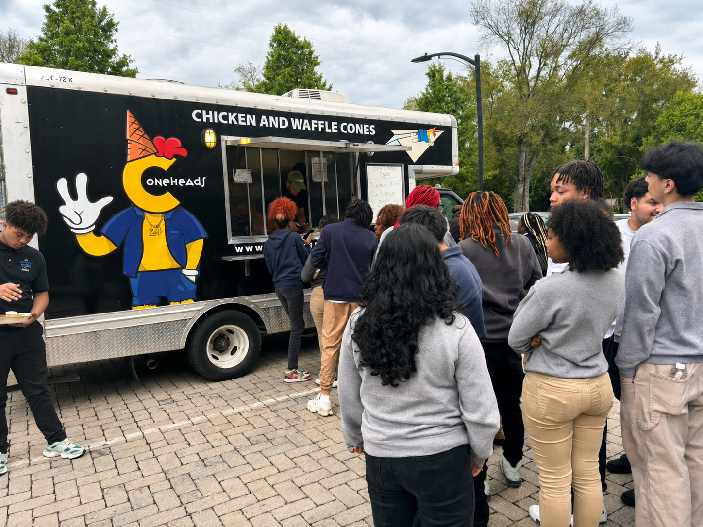 Students and families gathered at the Coneheads food truck during a Nashville community event