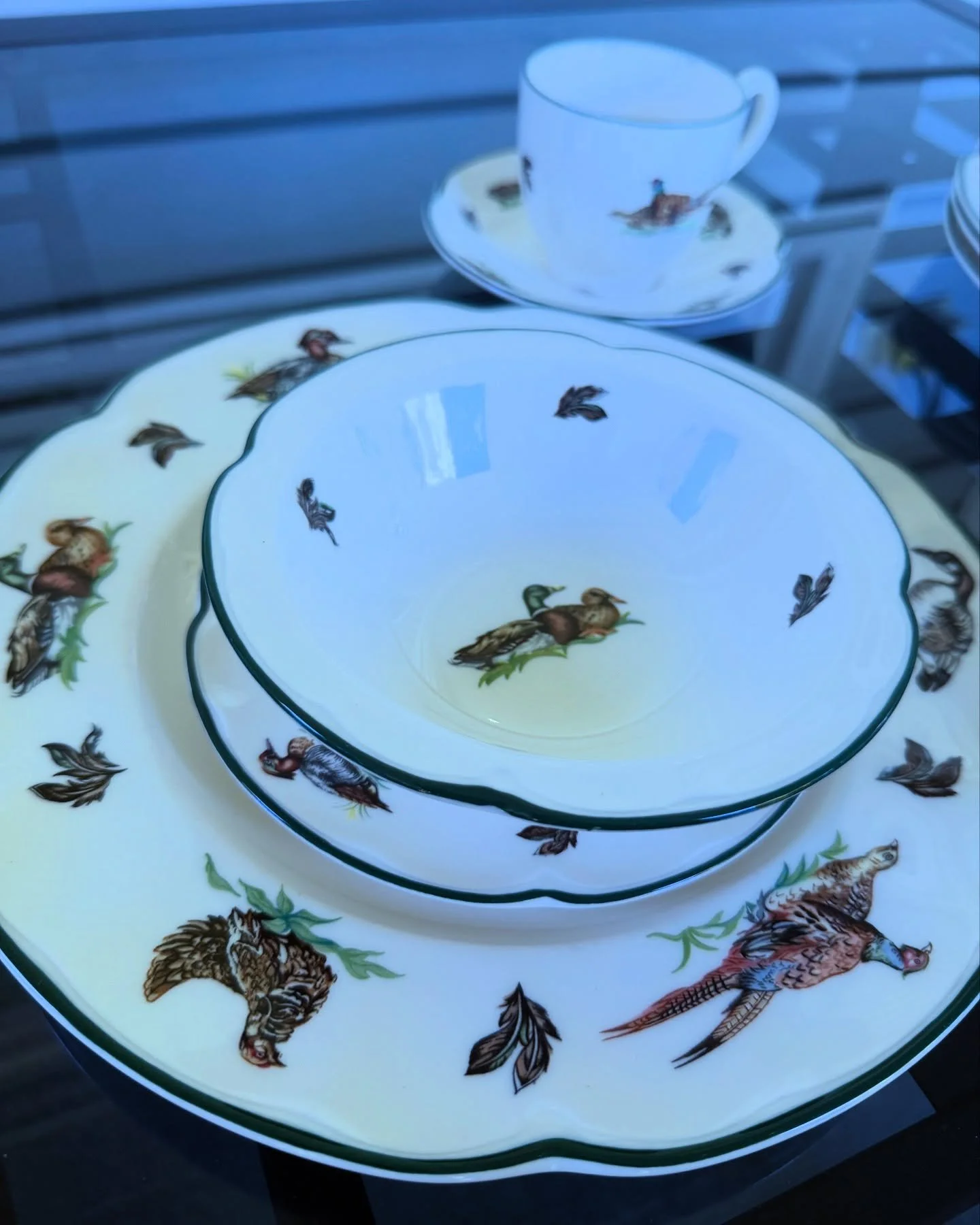 Stunning English porcelain Bone China Dinner or Luncheon set from Johnson Brothers. Decorated with the much coveted Brookshire pattern. Fabulous features with Ducks and pheasants. All the pieces are green trimmed.  The set includes - 4 dinner plates 