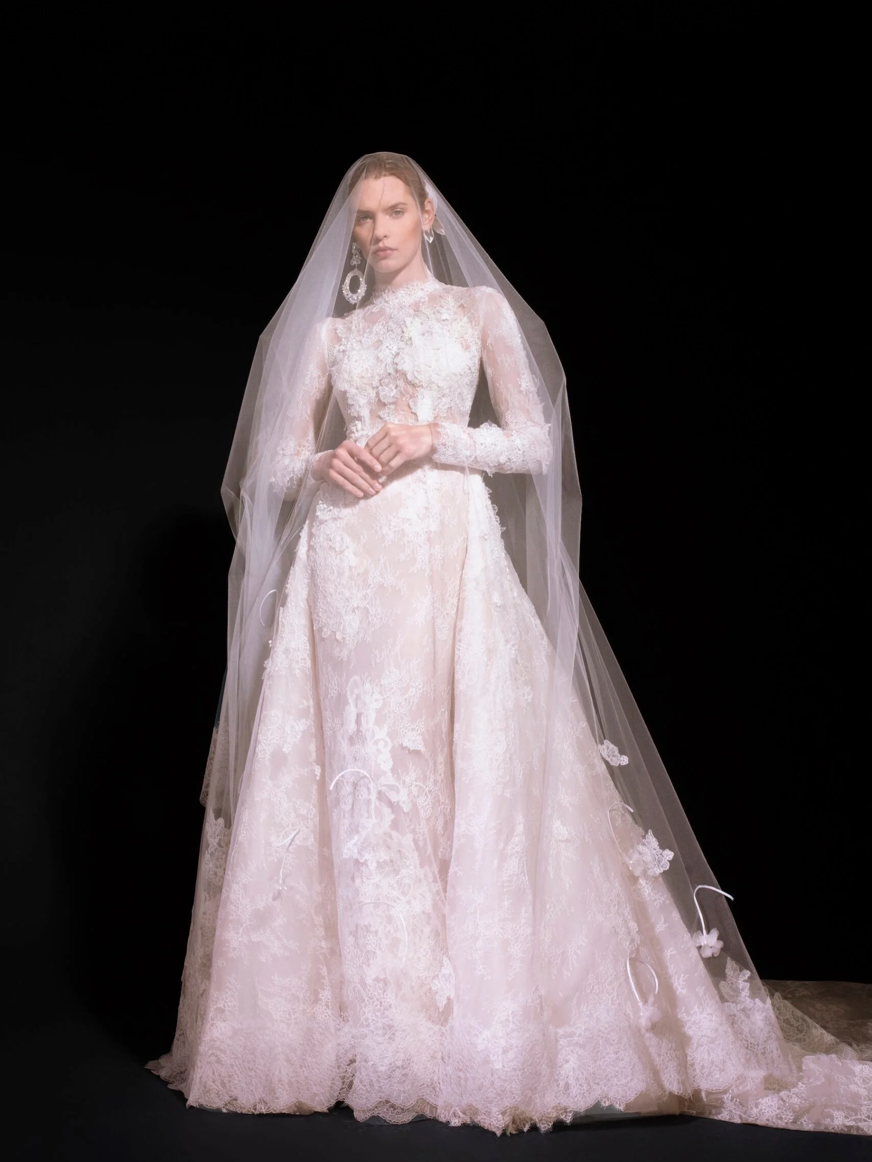 New Find: Yolancris CHIARA DRESS &amp; TAIL now 50% off. 
Classic and timeless elegance in this mermaid silhouette wedding dress made of lace and chantilly. With fitted long sleeves and a high semi-neckline, this bridal look stands out for its specta