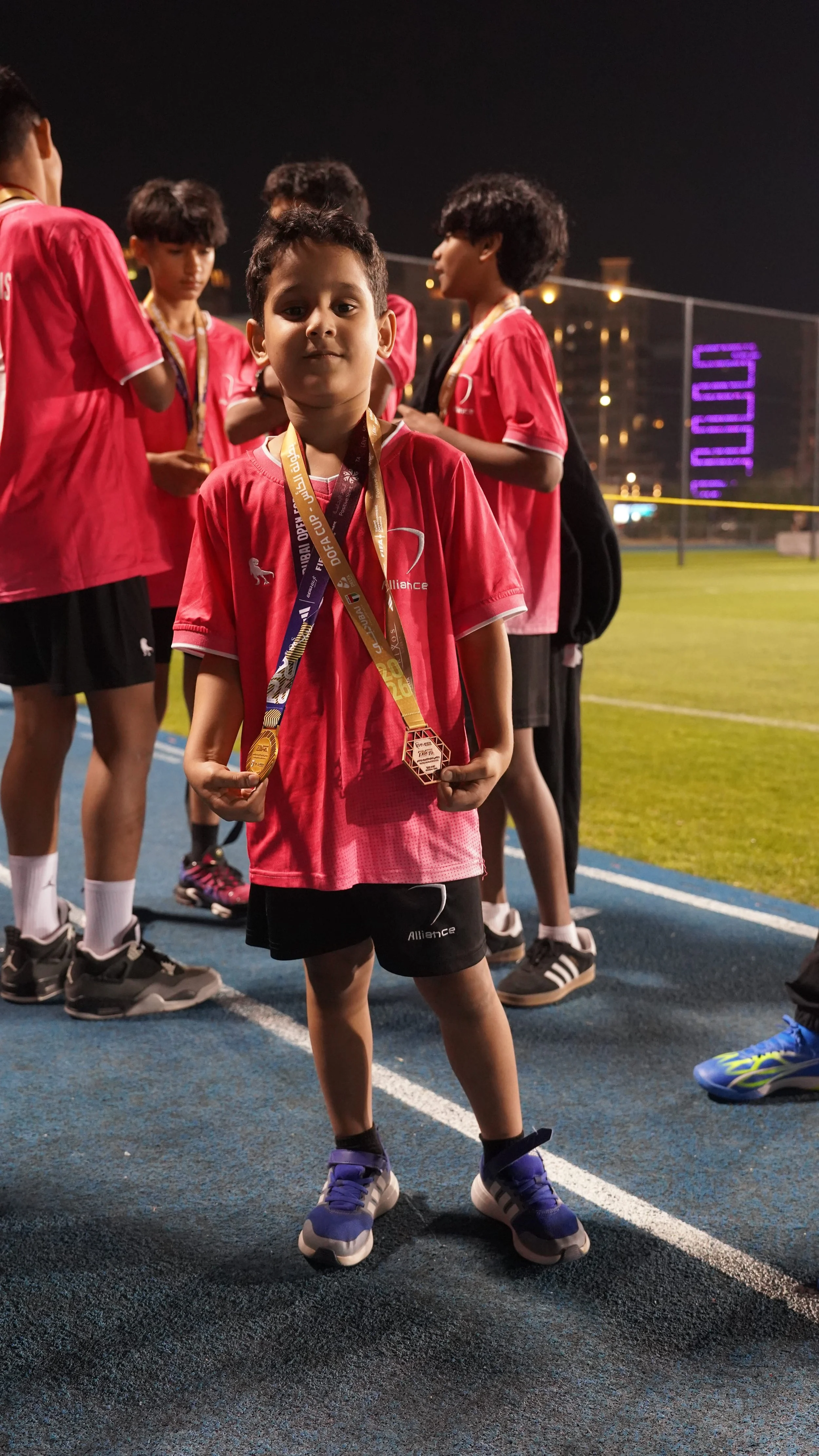 with his brothers medals.jpg