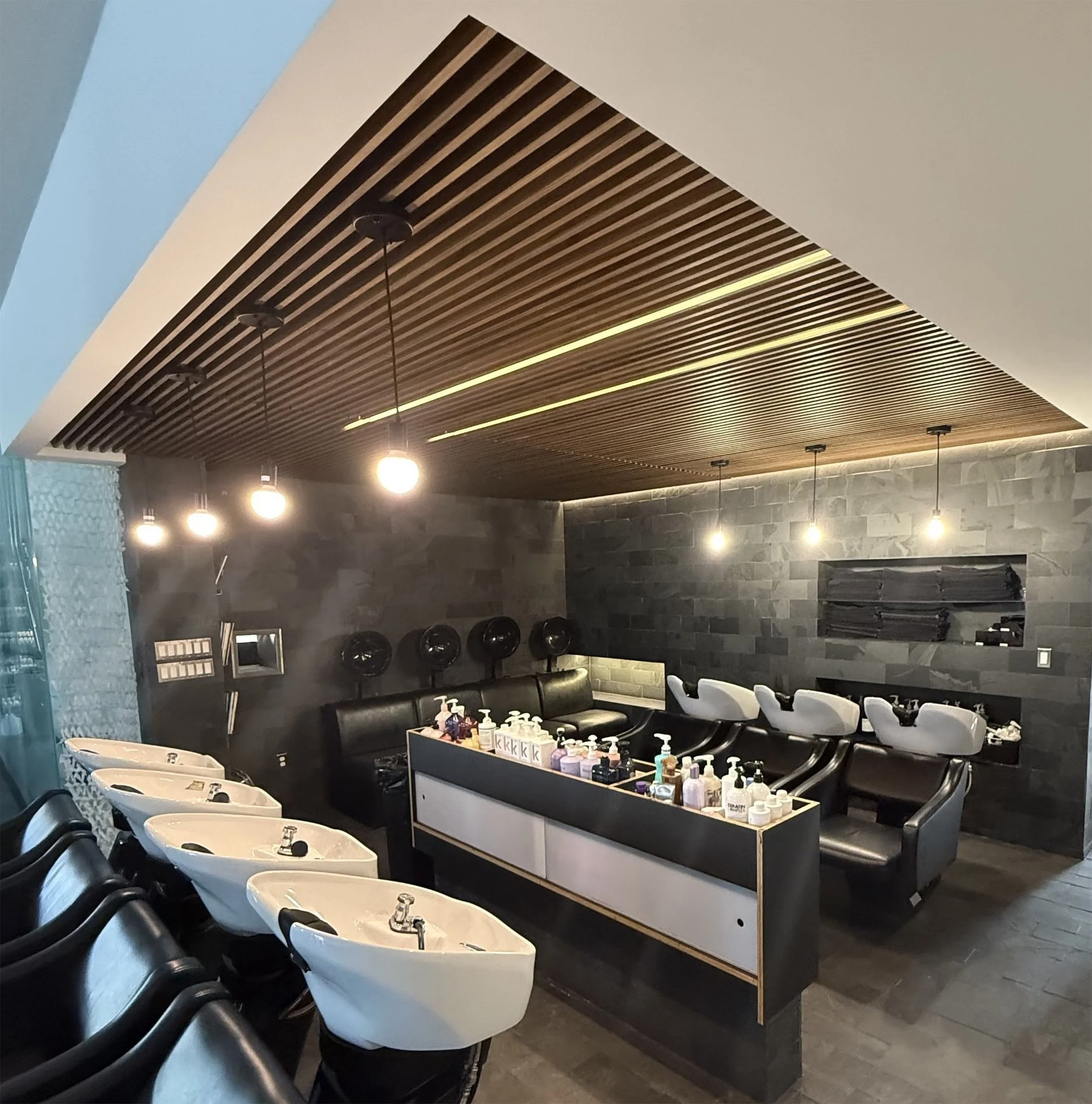 Salon-shampoo-chair-room-with-ceiling-using-WoodLine-Slat-Blades-in-dark-Walnut.jpg