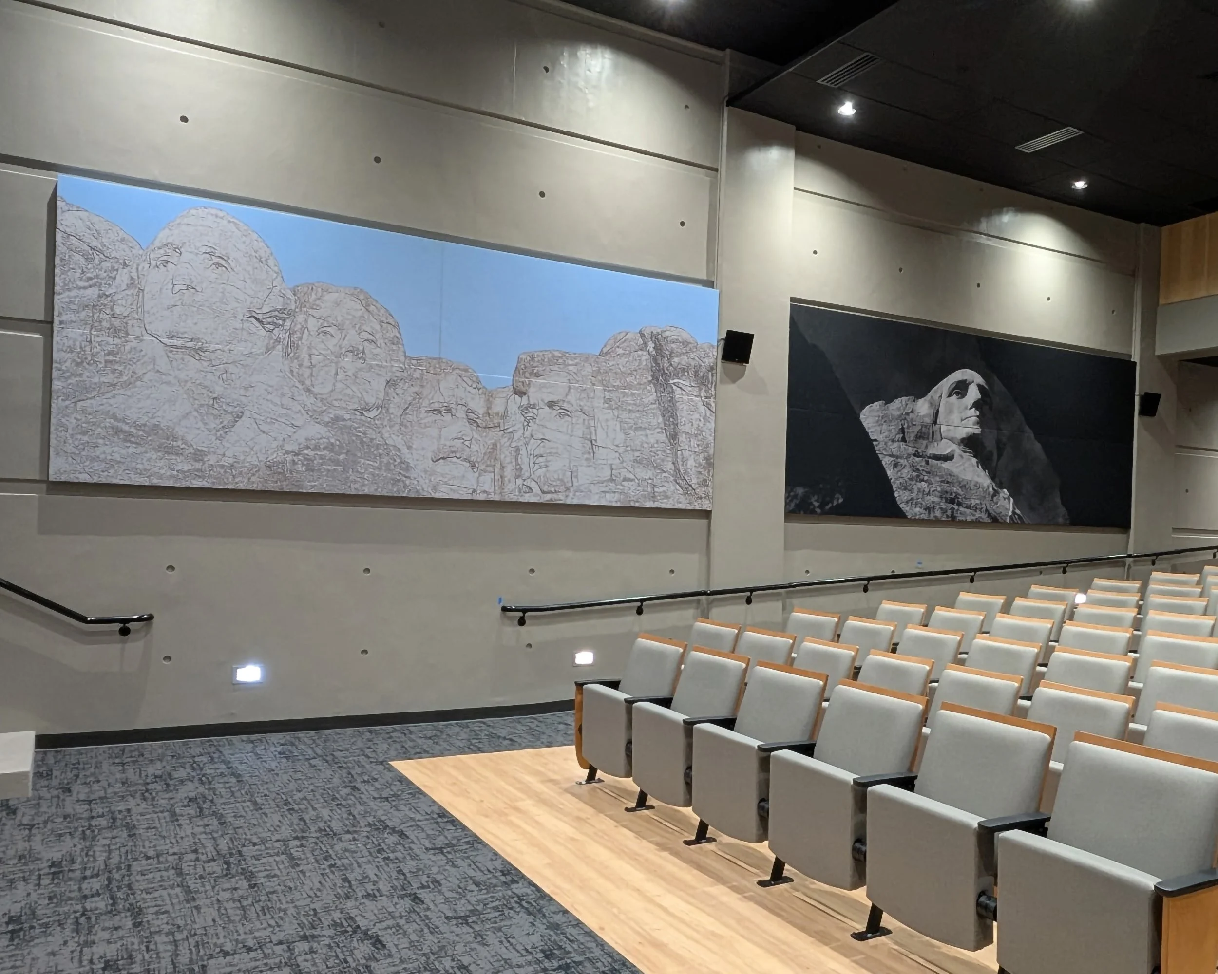 Auditorium with seating and large Livello acoustical Custom Art digitally printed Wall Panels of Mount Rushmore on the wall.