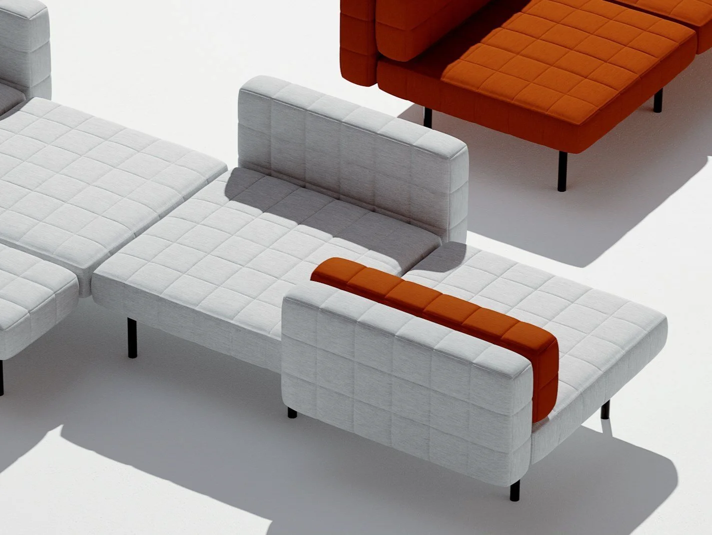 Modern sectional sofa with white upholstery and orange cushions on a white background