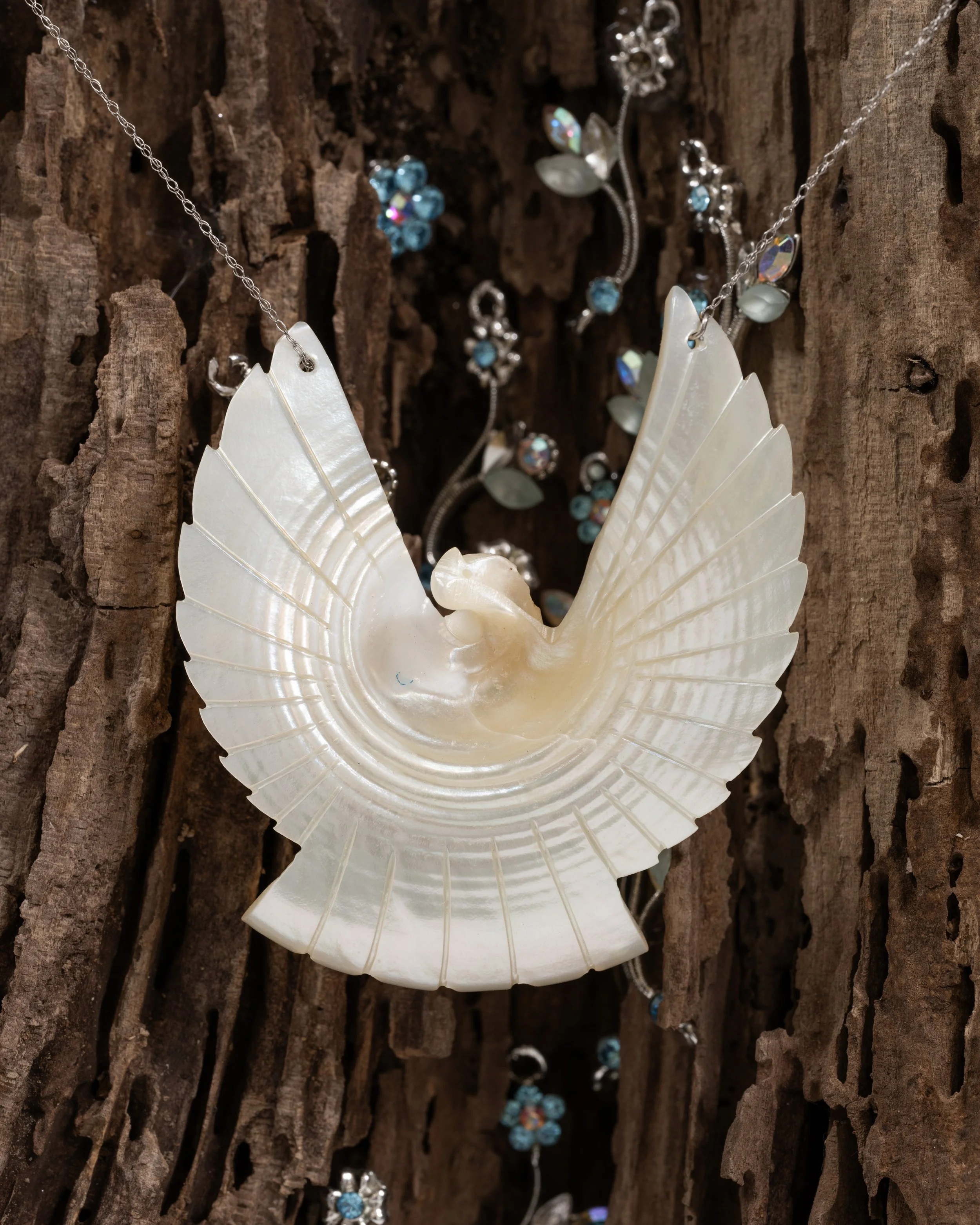 Ode to My Silence 
found wood, seashell dove, chain, rhinestone floral charms
2021, 10" x 17" x 14" 