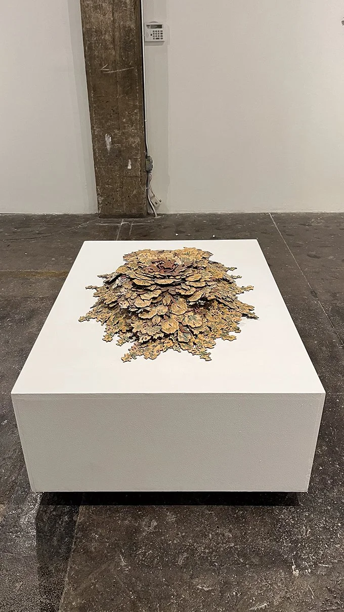 collaged floral laminate flooring bouquet on a pedestal