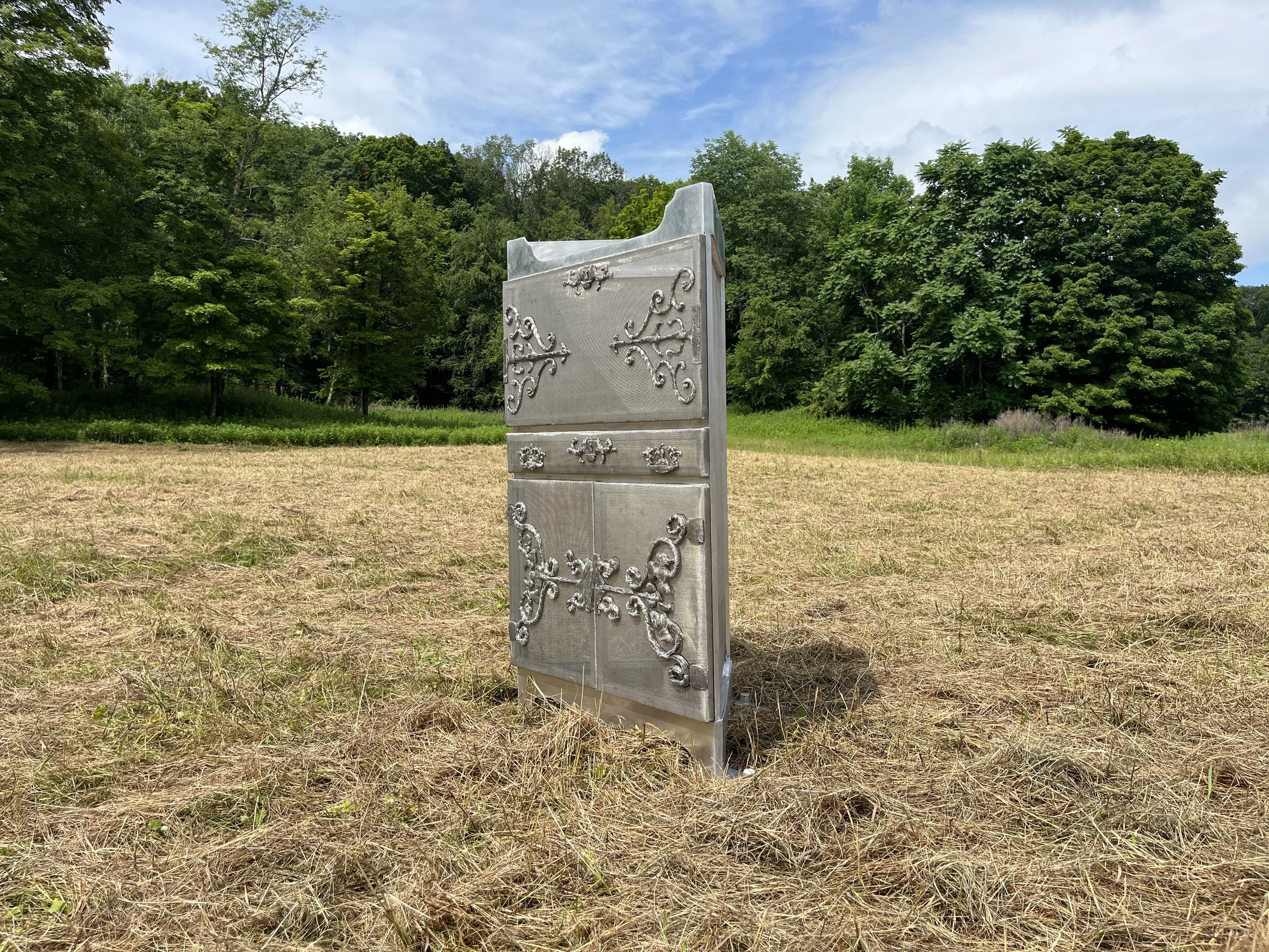 "A Corner"
aluminum, mild steel, stainless steel
2025,    48” x 28” x 17”

A phantom of an original family heirloom corner cabinet, this sculpture reflects on our desire to cherish and preserve while facing the inevitability of change and life cycles