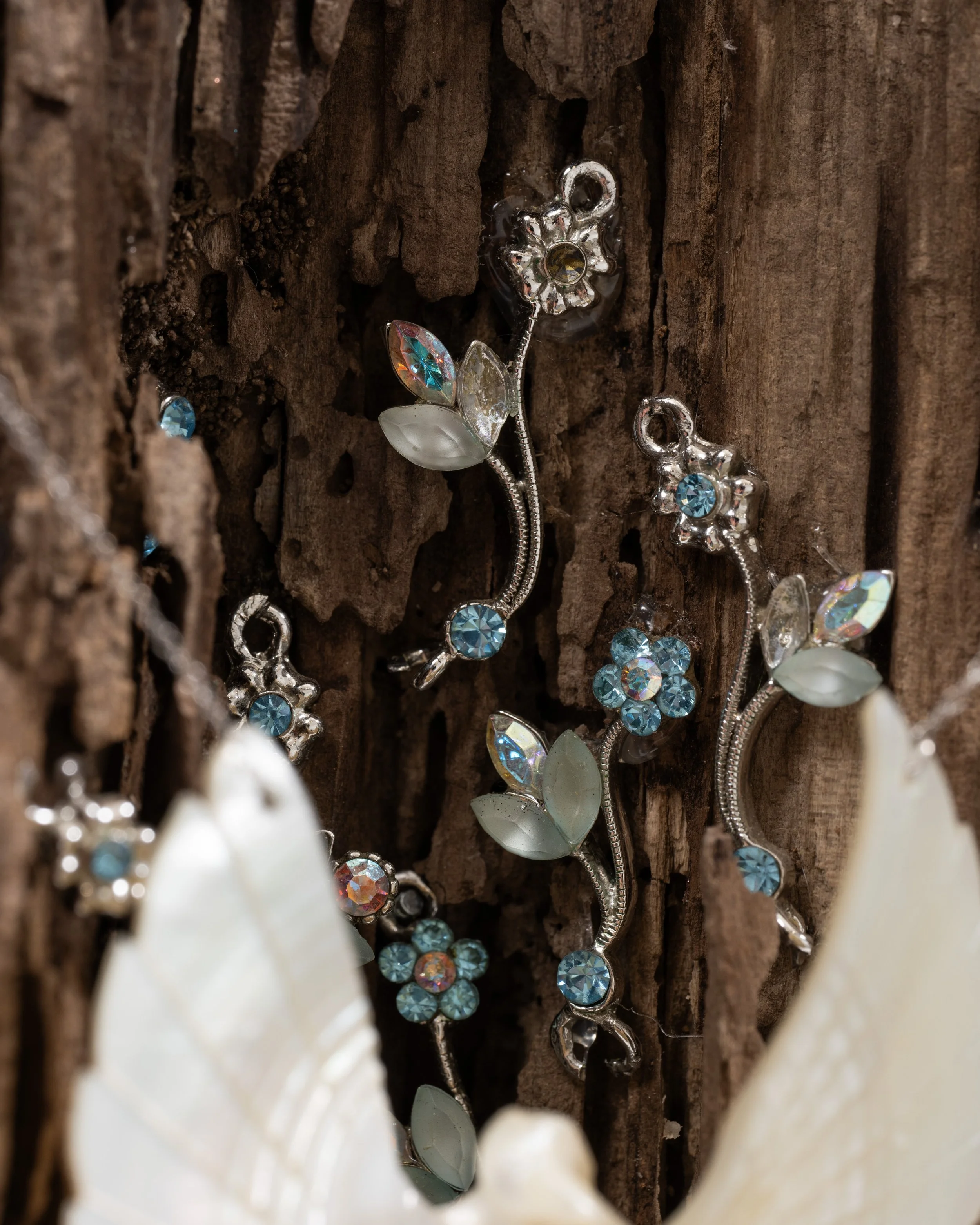 Ode to My Silence 
found wood, seashell dove, chain, rhinestone floral charms
2021, 10" x 17" x 14" 
