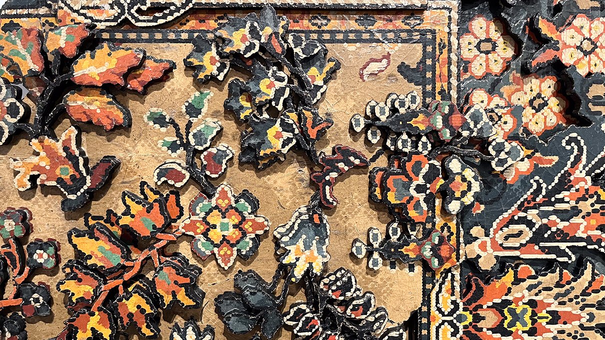 Close up of collaged floral laminate flooring tiles
