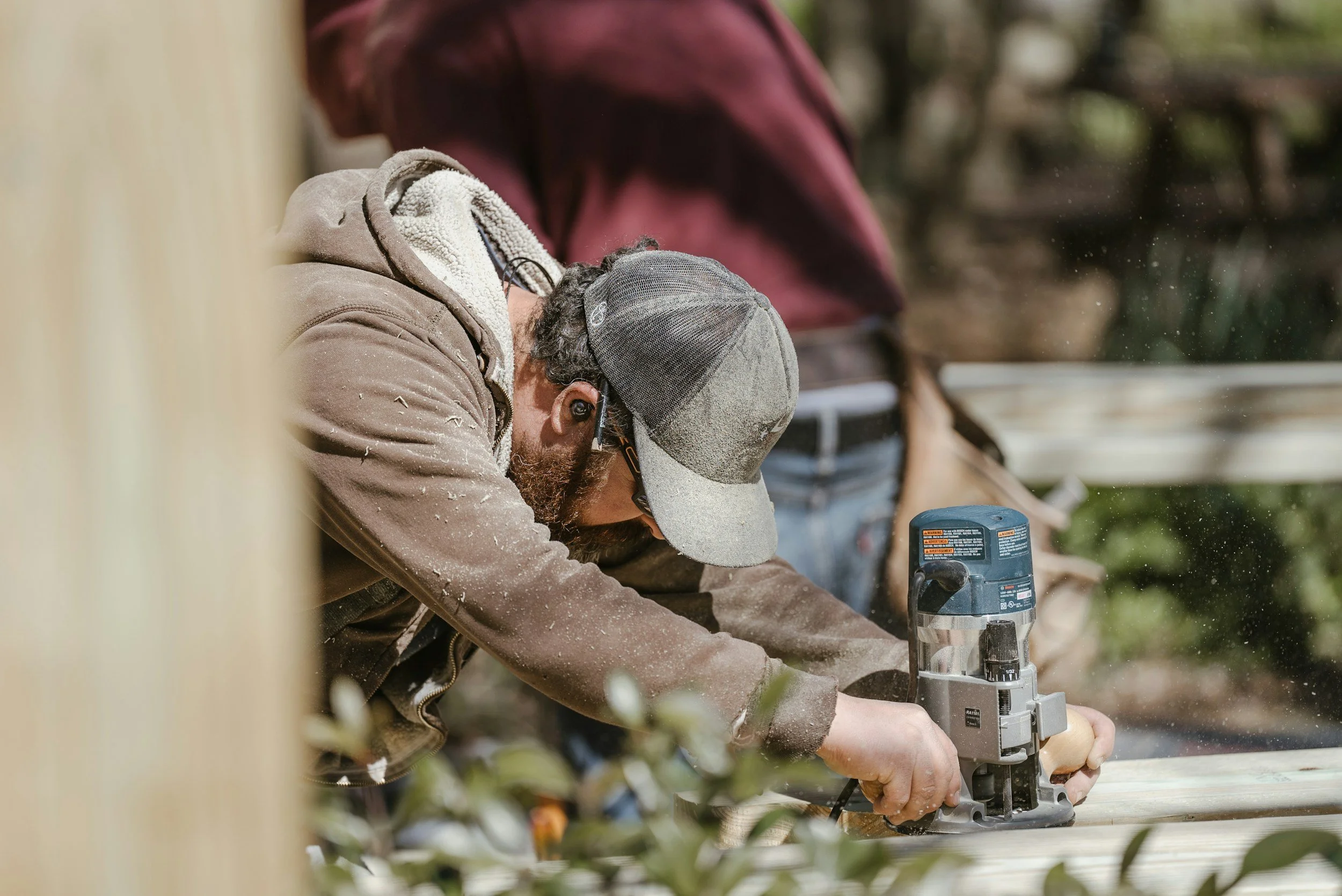guy using a router on a piece of wood