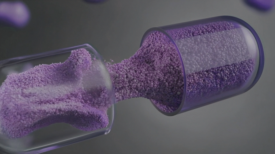 Purple microscopic particles flowing from a container into another container, resembling a close-up of a scientific or laboratory process.