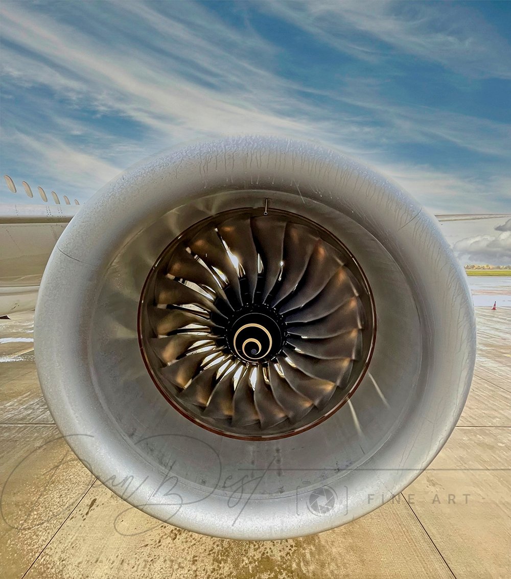 Close-Up Of Airplane Engine At Runway Against Sky
