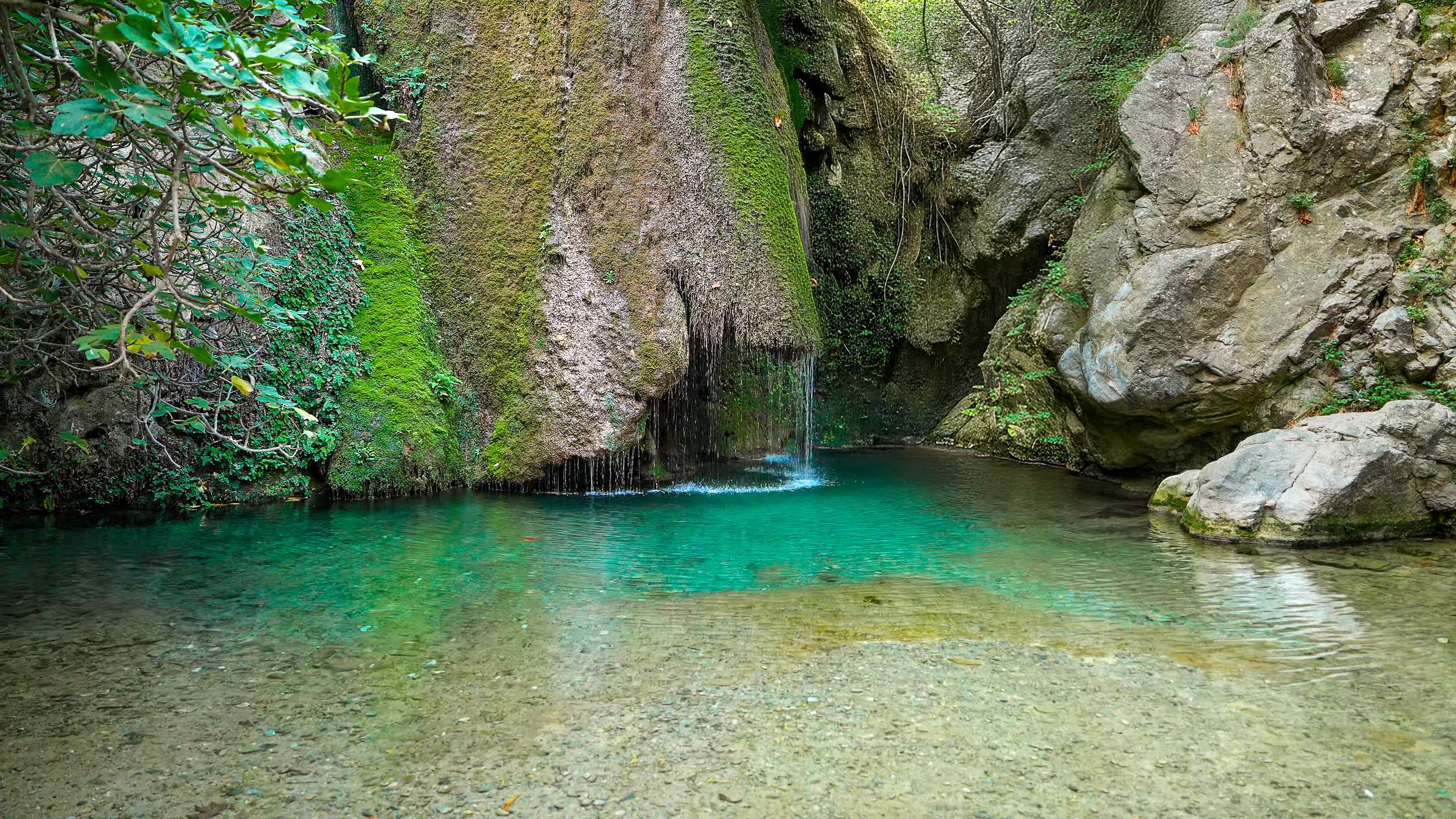Turquoise pool waterfall in Crete, Greece from the 3-hour calming piano music video Reflective Retreat by Dean Best.