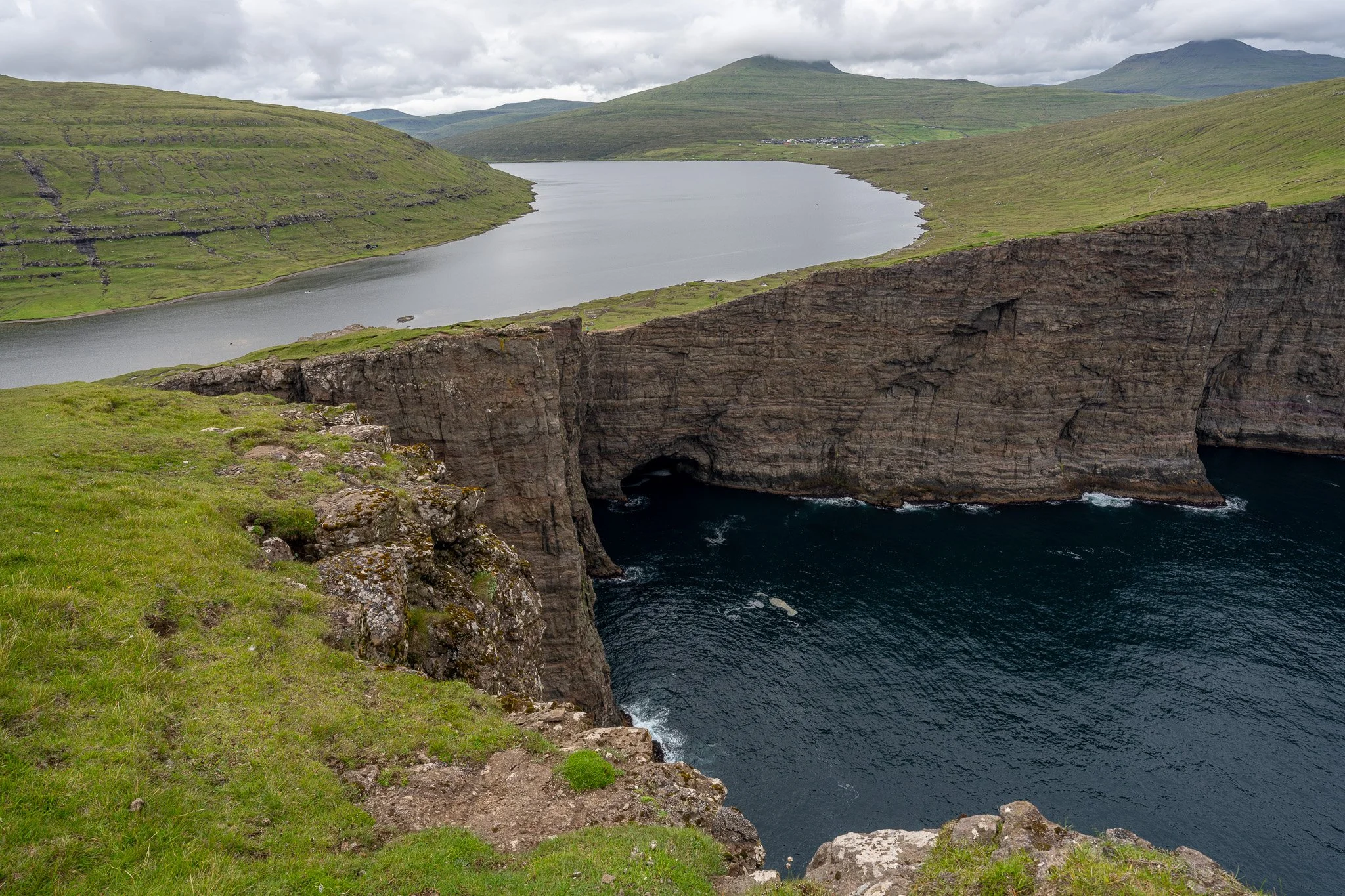 Faroe Islands sea cliffs above deep blue ocean water with a wide horizon, filmed by Dean Best for the Relax With Dean calming piano music video Boundless Calm.