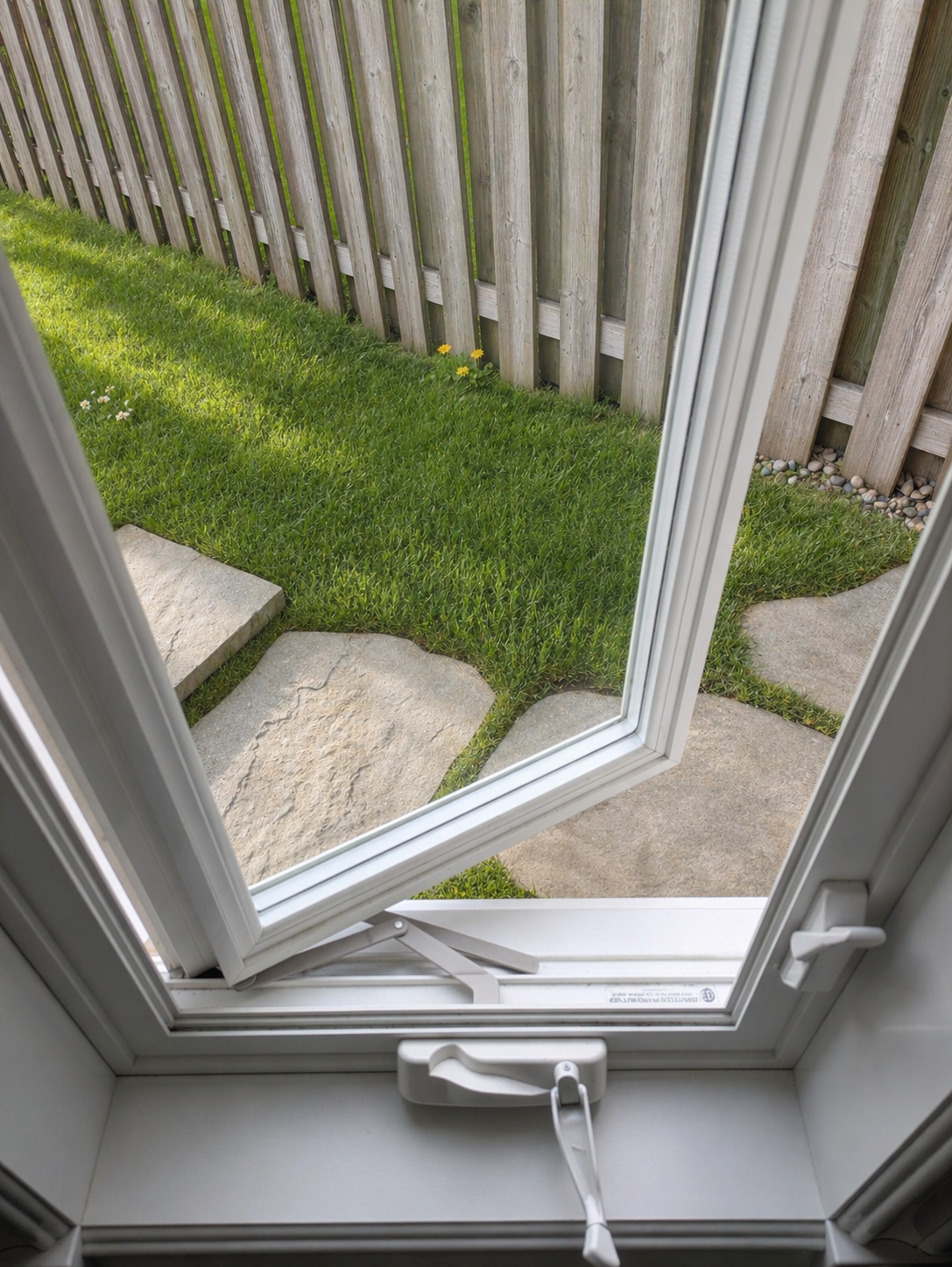 Open window showing very clean tracks. What a customer could expect from Simcoe County Window Cleaner's track detailing service.