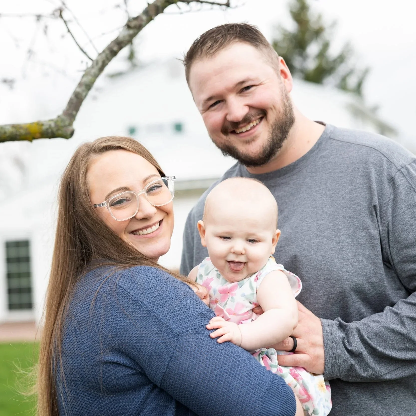 Natural family portrait with baby in soft outdoor light