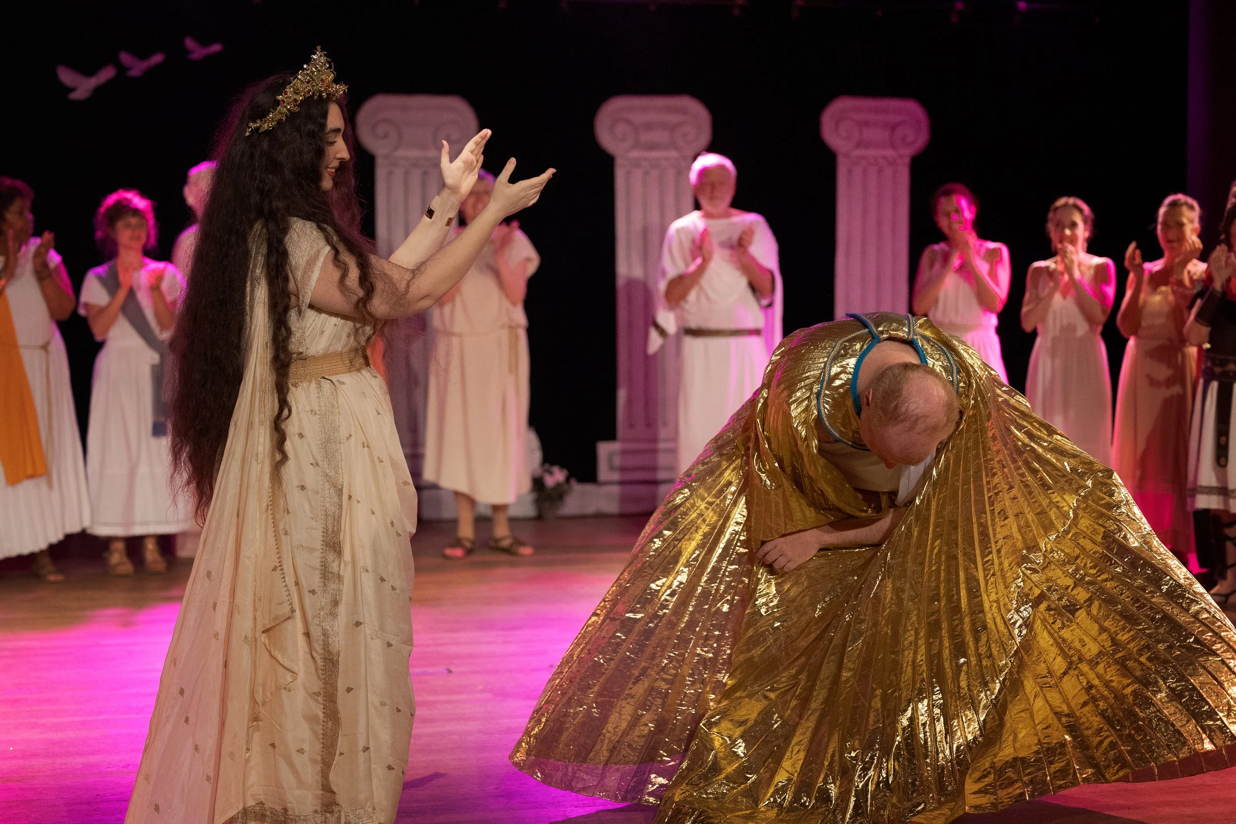 Hélène applauds a fellow performer taking a bow at the end of La Belle Hélène in Paris.