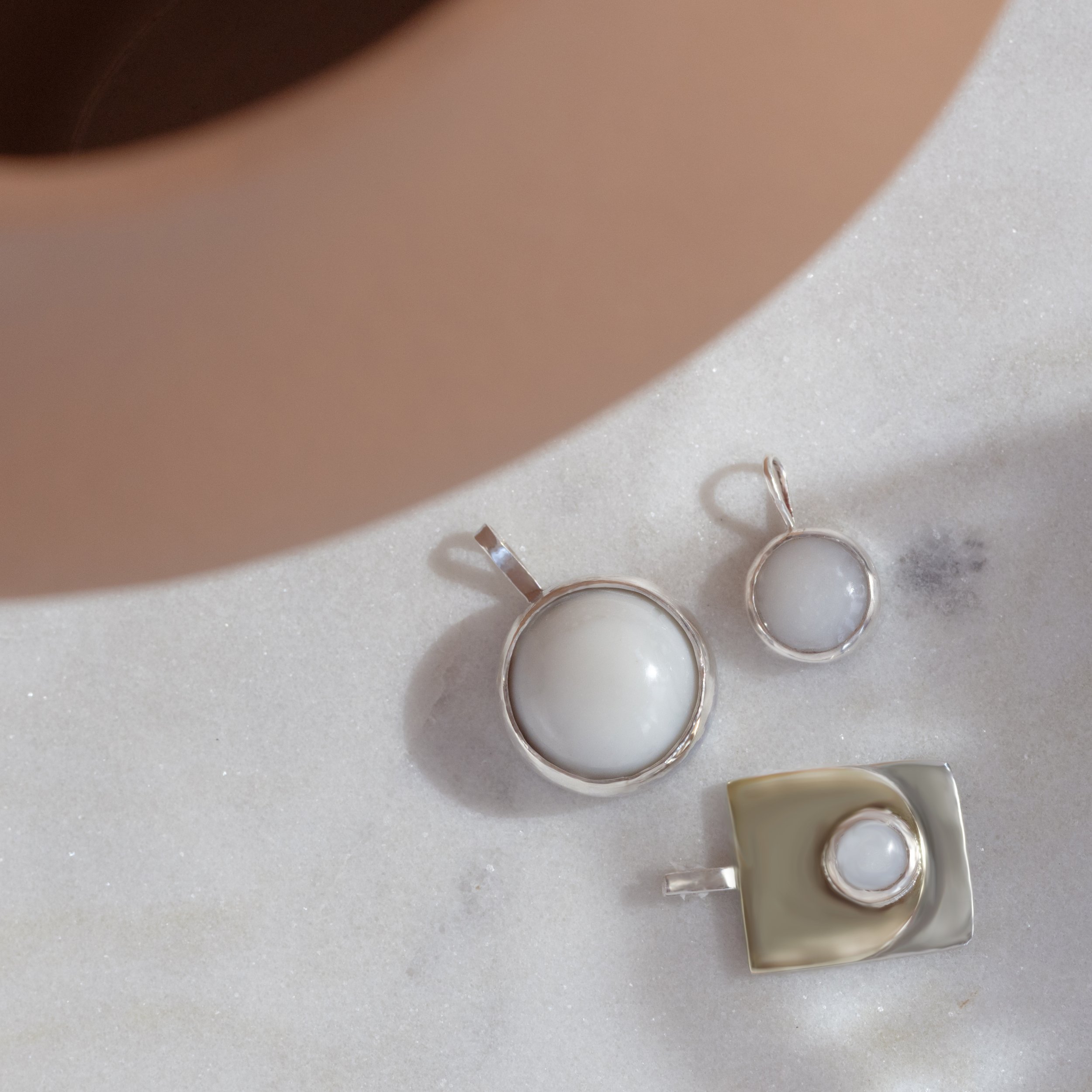 three breastmilk pendants.jpg