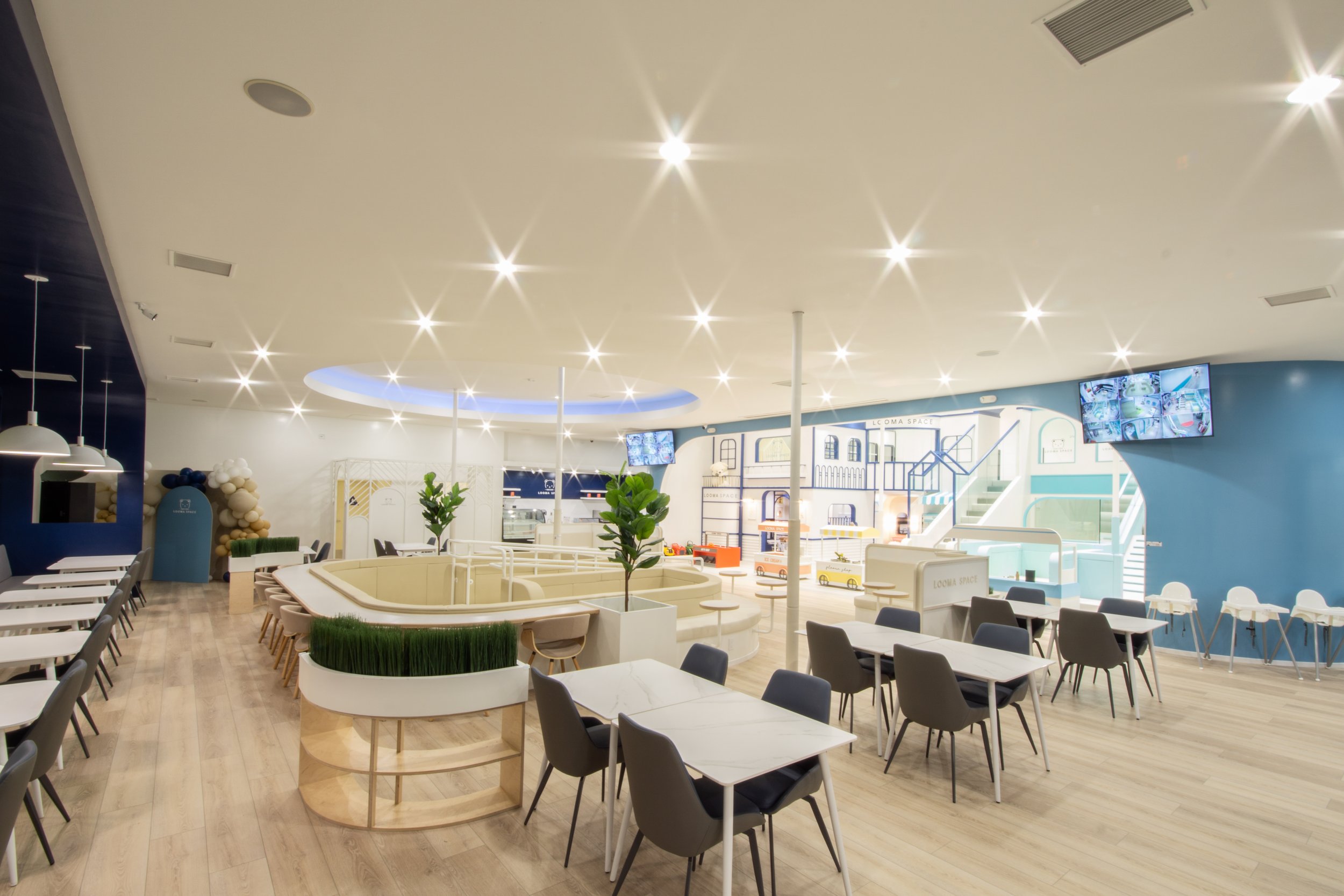 The airy, pastel play village inside LOOMA Space