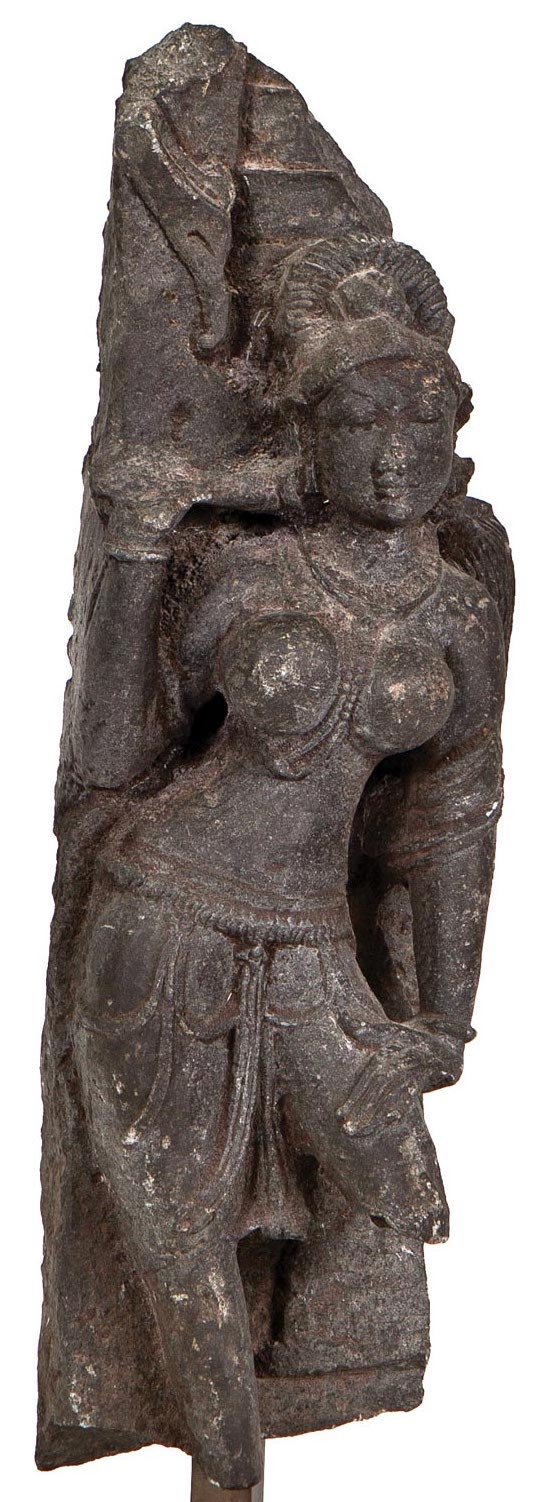 A stunning large black stone statue of a Yakshi, or female nature spirit who embodies fertility and prosperity. India, 11-12th century C.E.