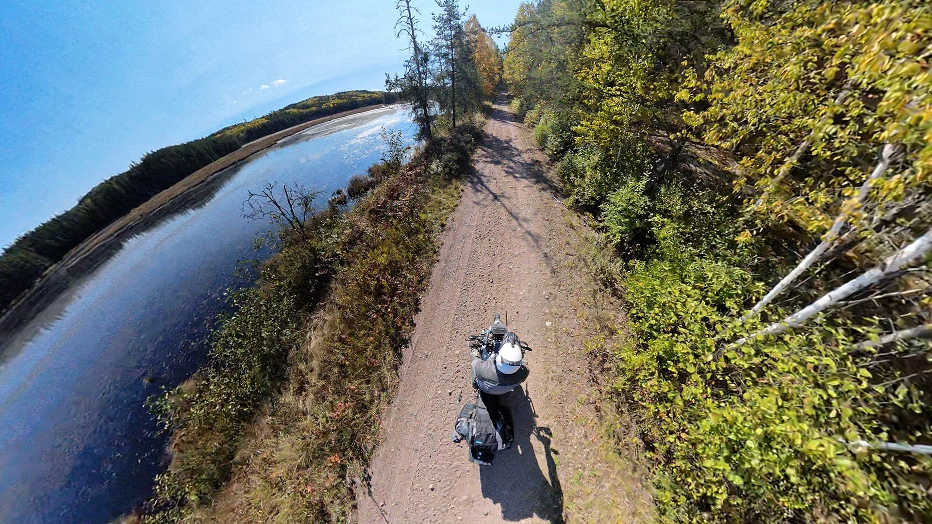 ADV rider by a lake, Algoma, Ontario.