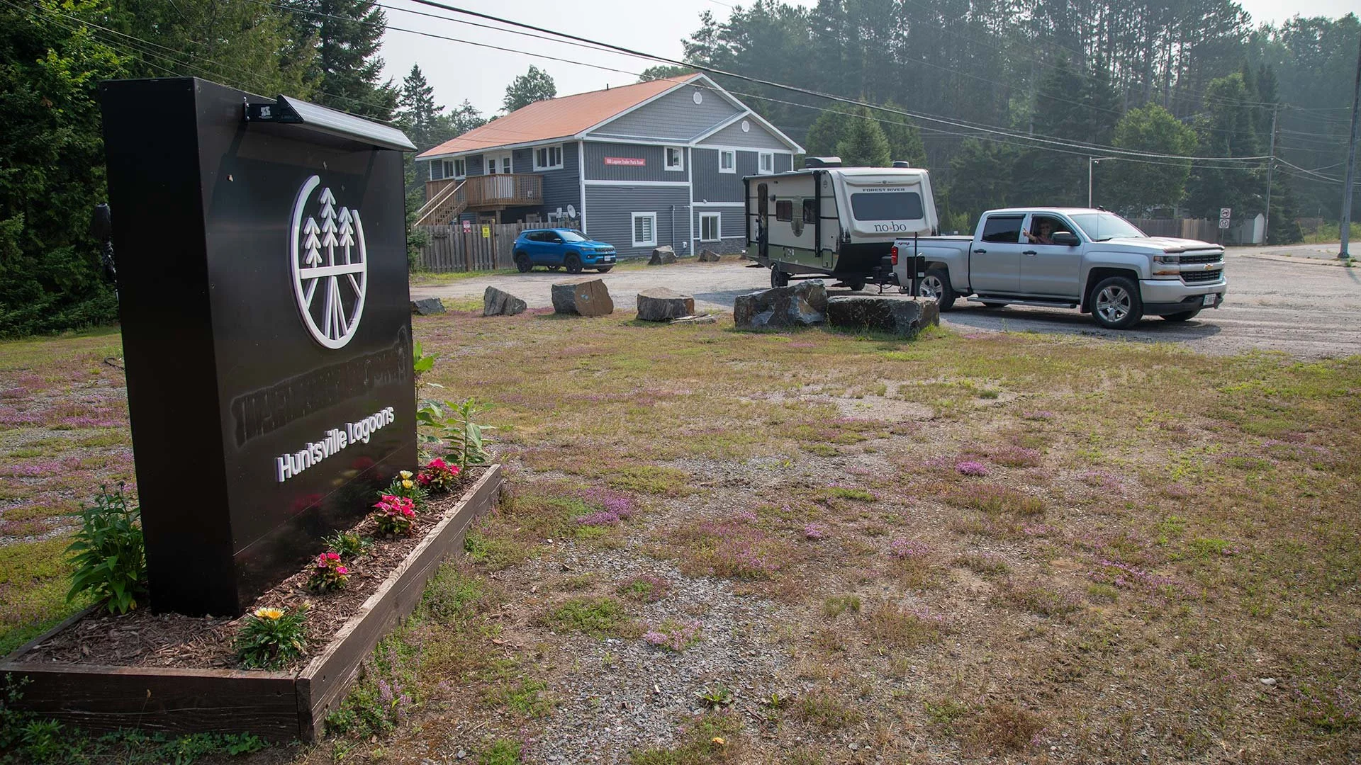 Arriving at Huntsville Lagoons RV resort sign and camper.