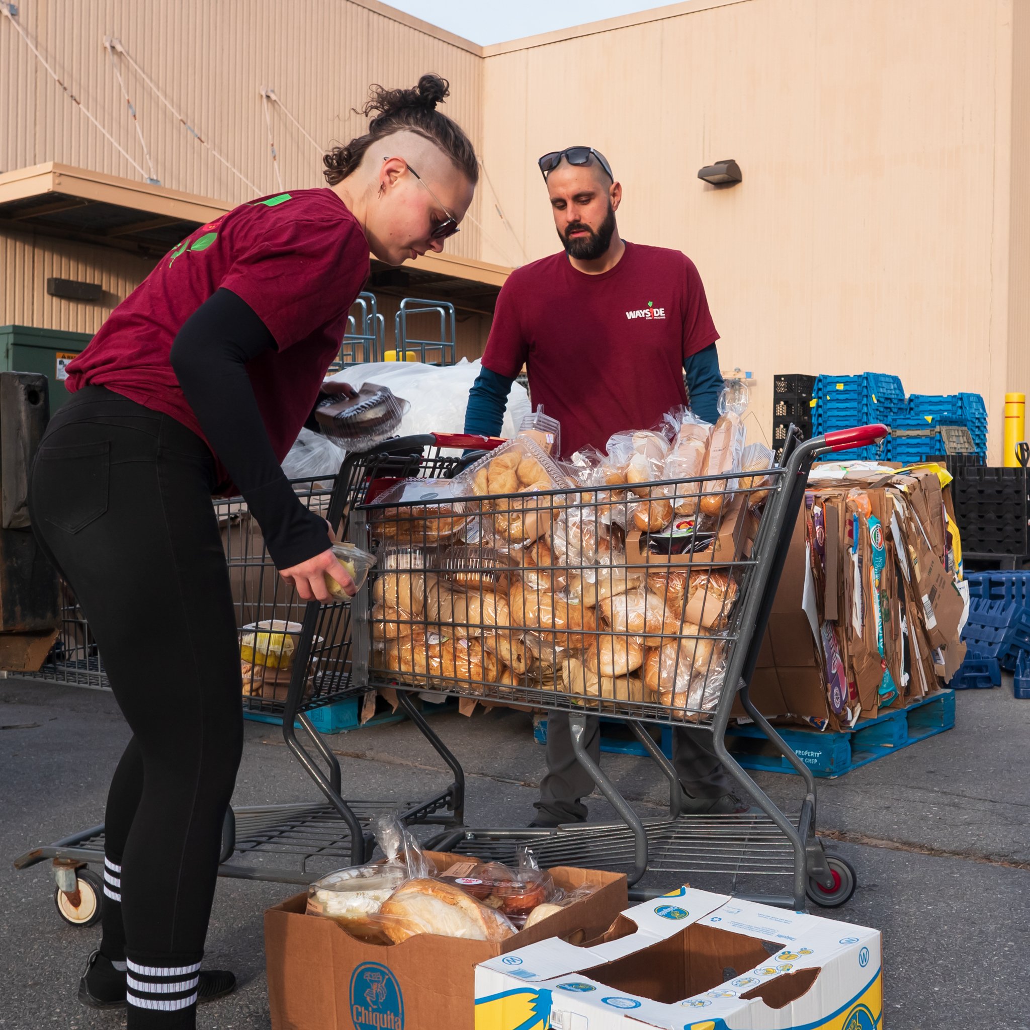 Man and woman moving food carts