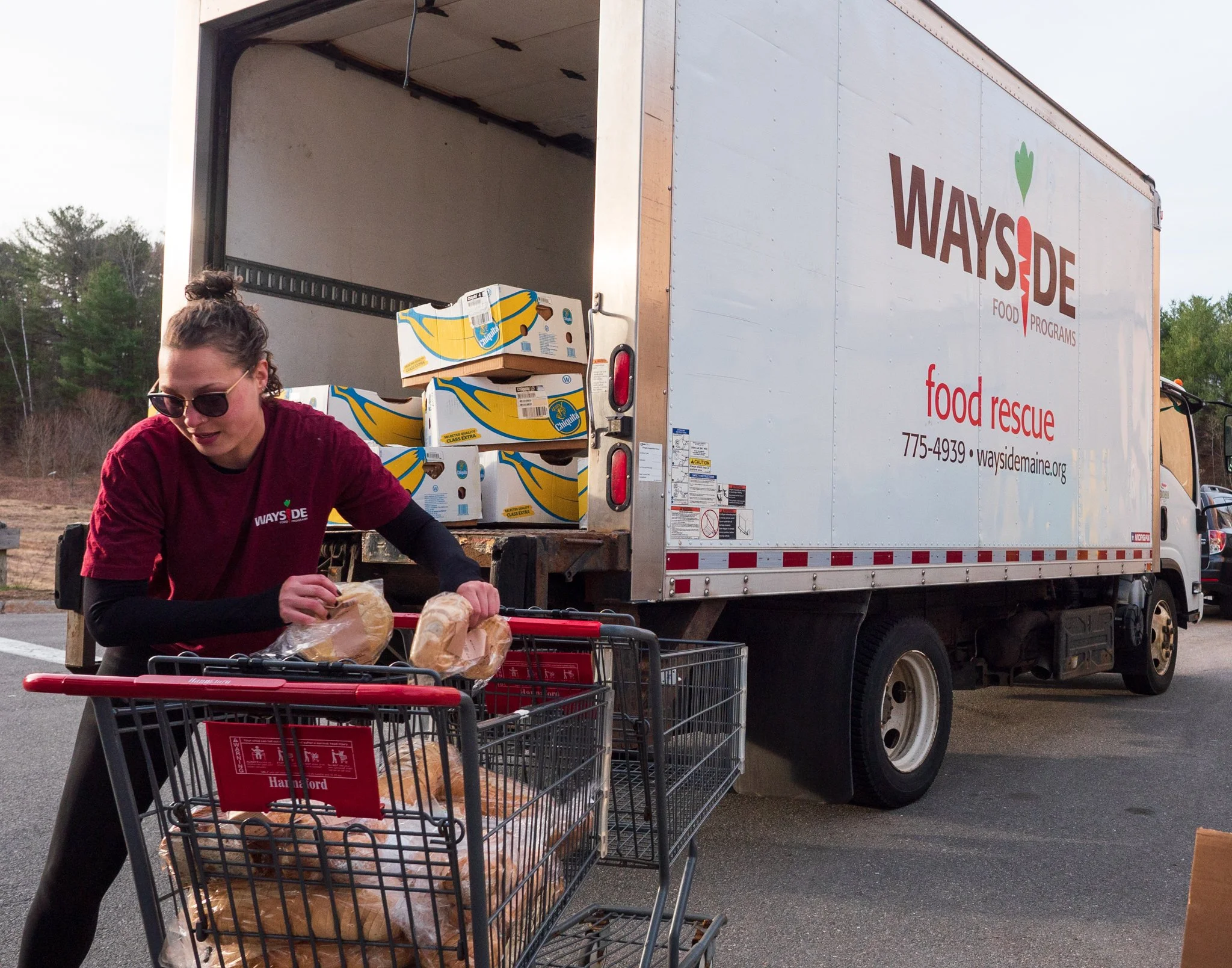 Woman loading food into boxes