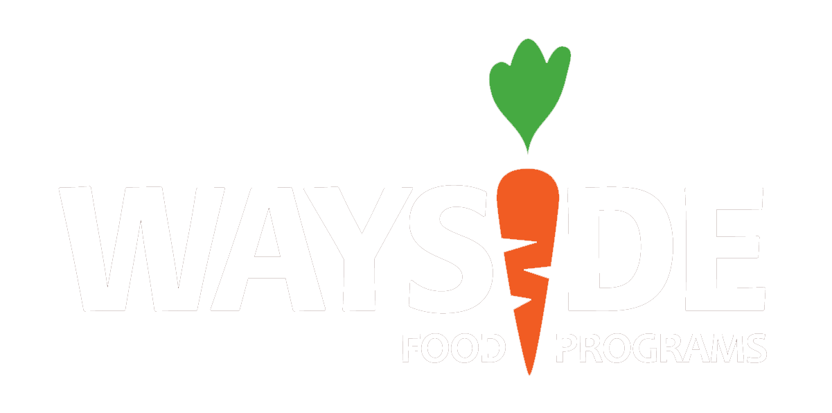 Logo for Wayside Food Programs featuring a stylized orange carrot with green leaves above the 'Y' and 'D', and the text 'WAYSIDE FOOD PROGRAMS'.