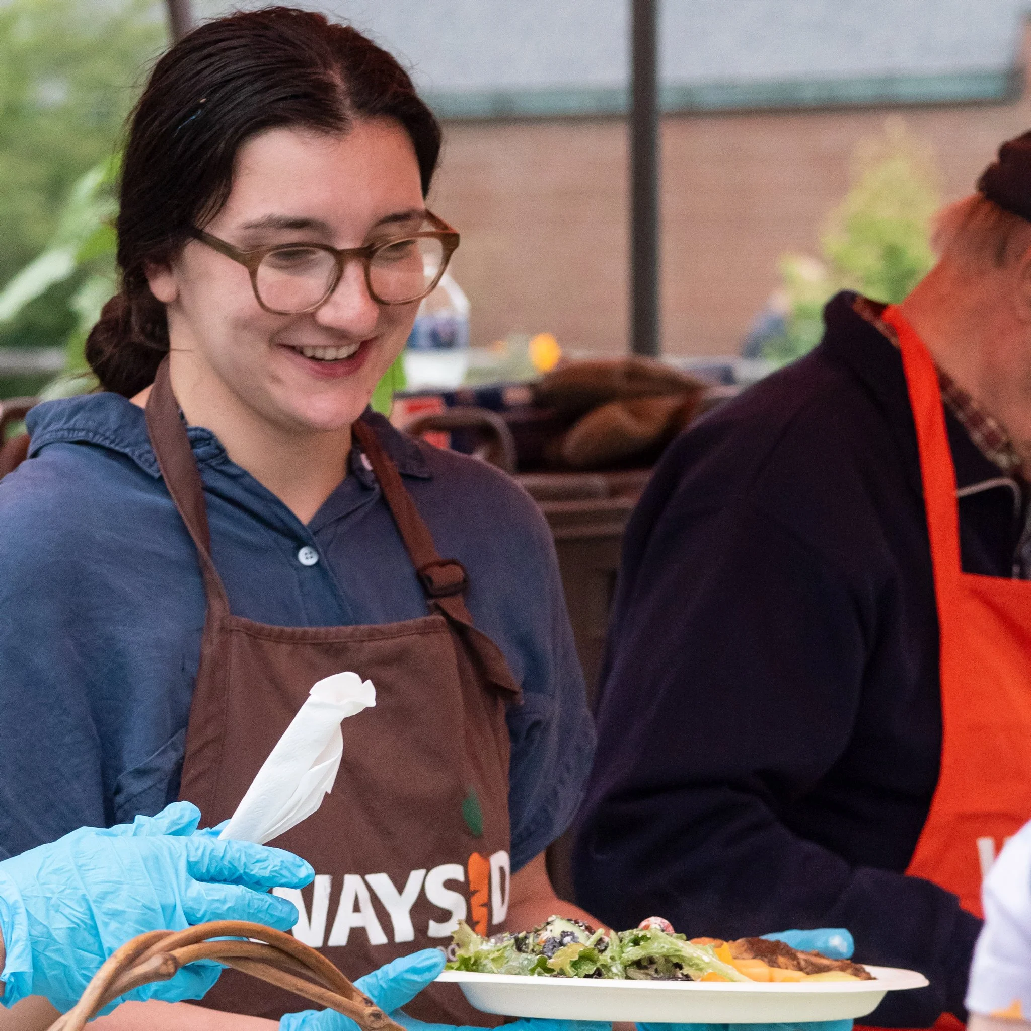 Volunteer serving food