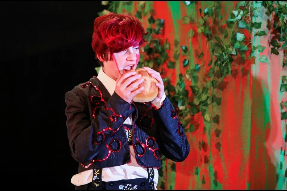 The Knave of Hearts eatting tarts