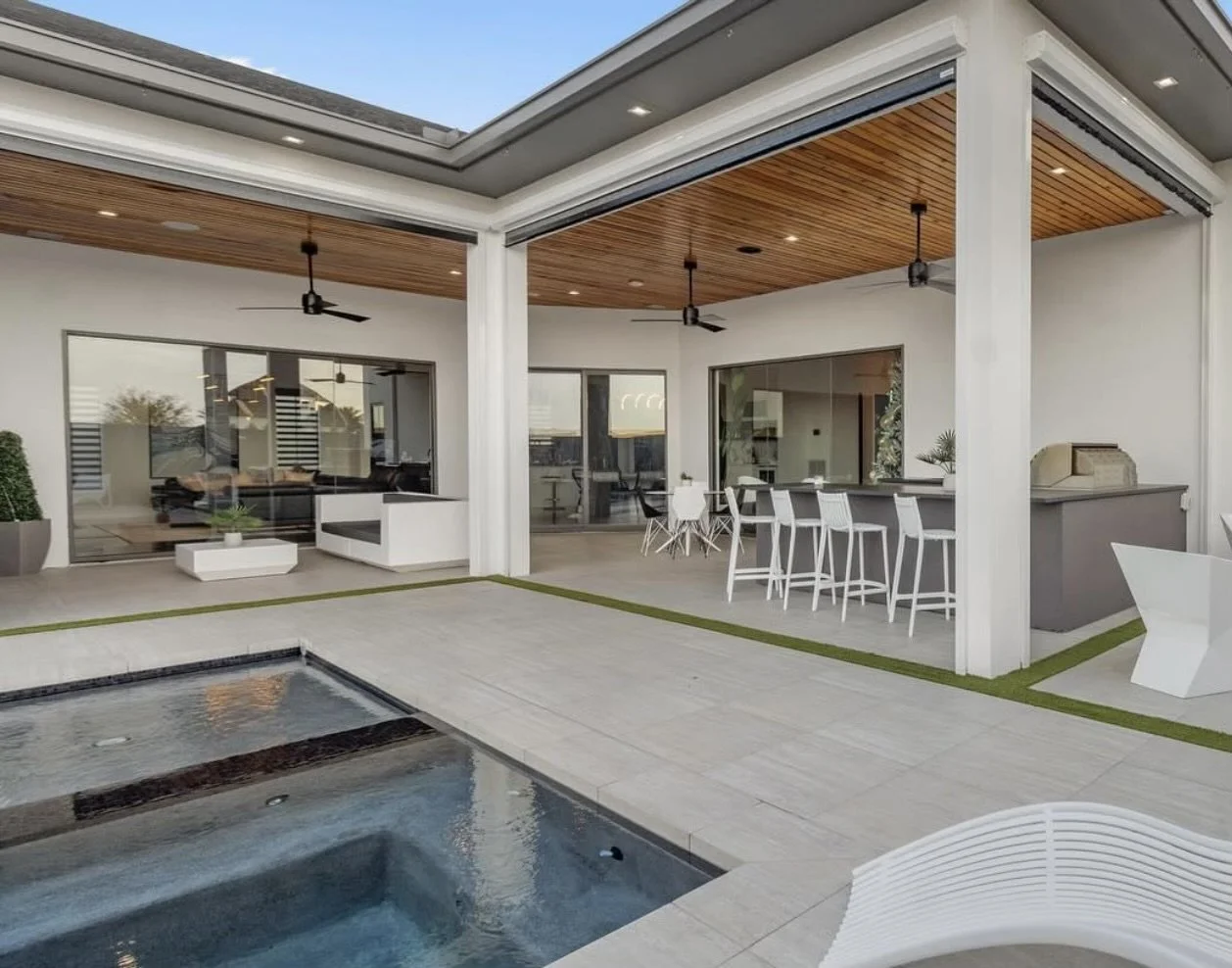 Modern outdoor patio with seating and pool