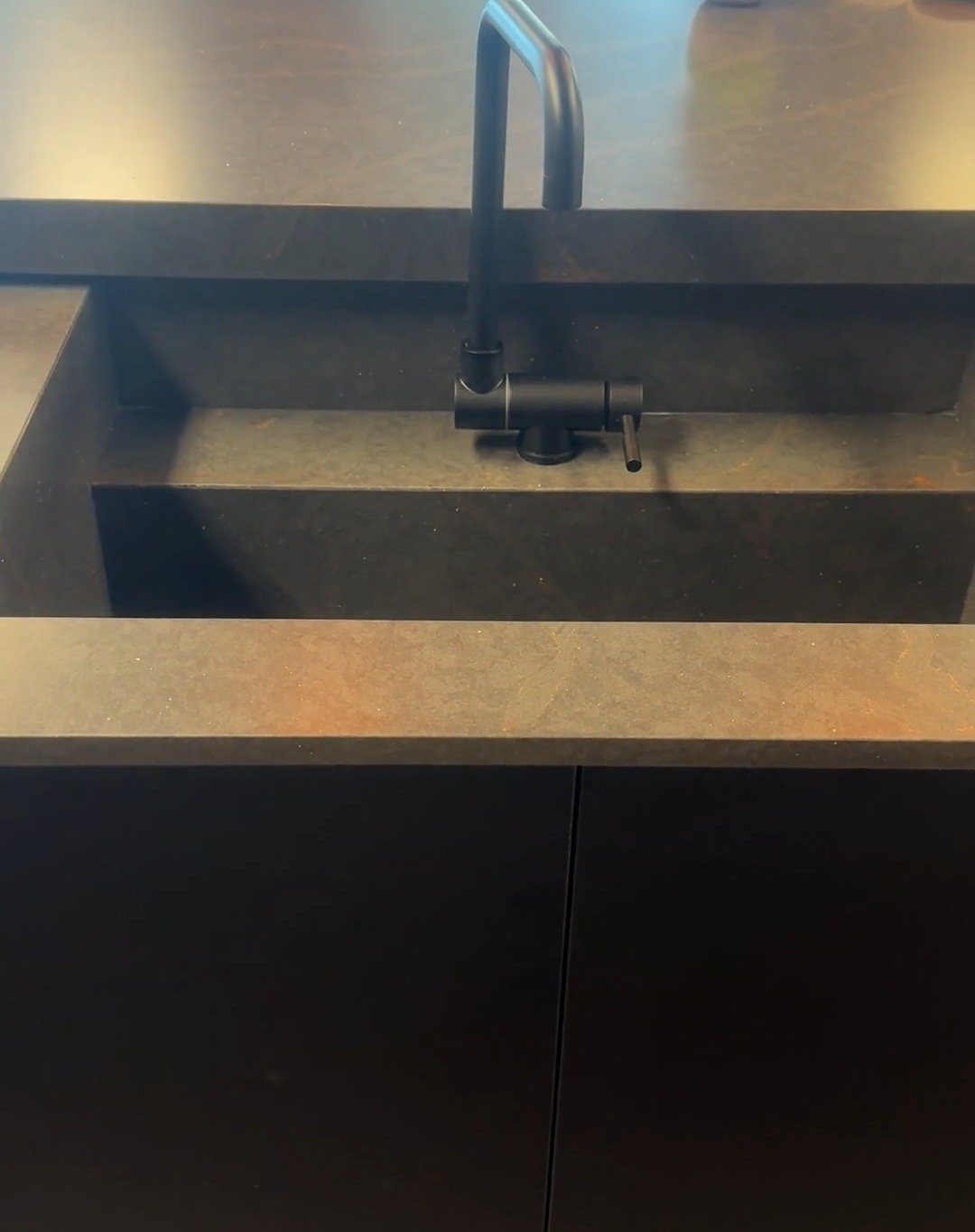 Sliding countertop hides an island sink - Let us wow your kitchen with this amazing feature. You can easily slide it to have a seating section when you open up the sink section. A collapsible faucet folds down to allow the countertop to slide over th