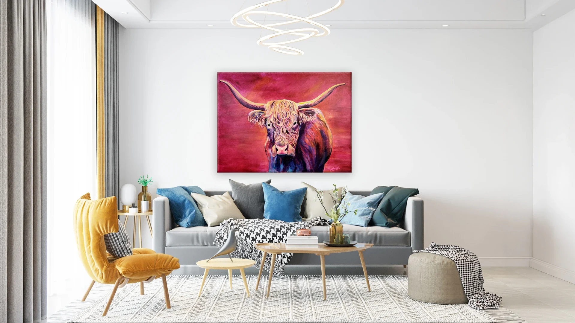 A large, colorful original acrylic painting of a Scottish Highland Cow with vibrant pink, magenta, and orange tones, hanging on a white living room wall above a modern grey sofa with decorative pillows.