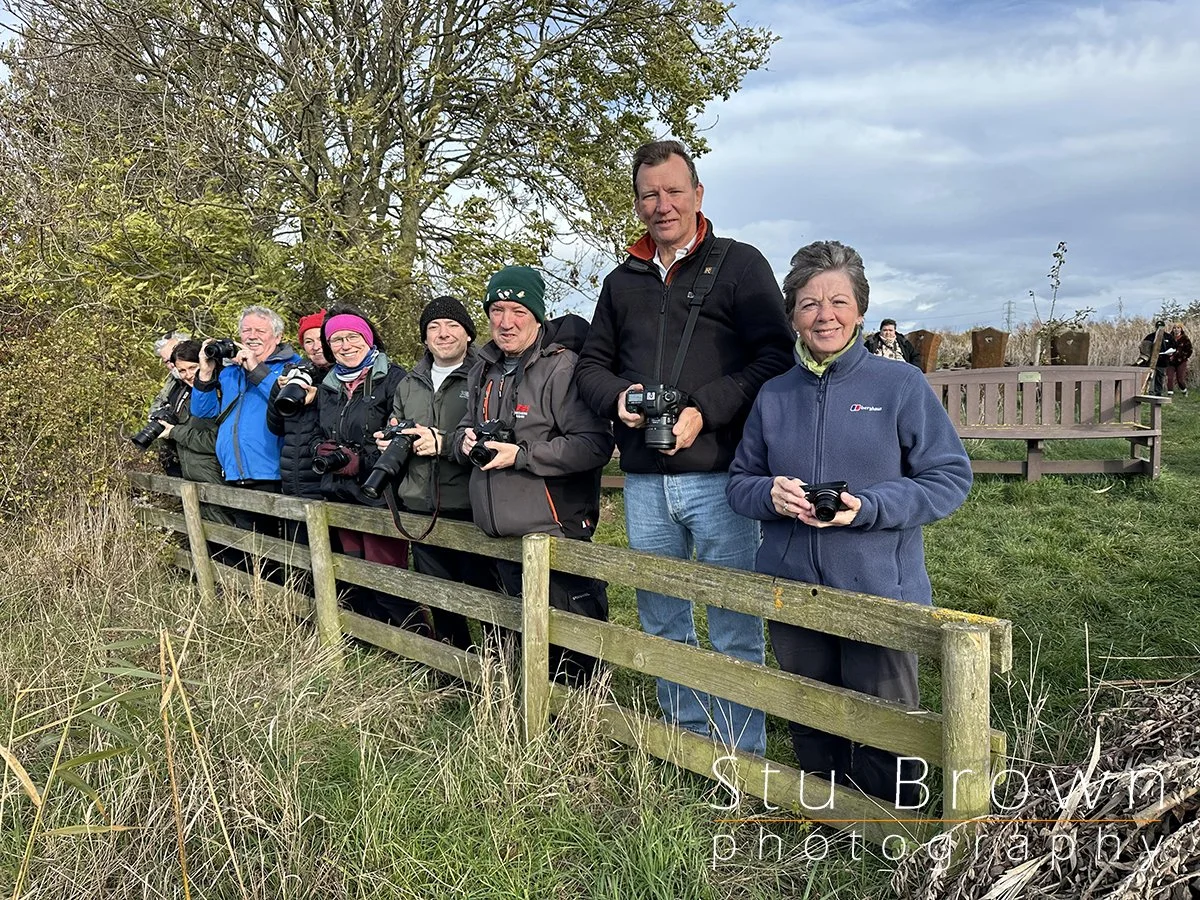 Group of amateur photographers learning together on a Stu Brown Photography workshop outdoors.