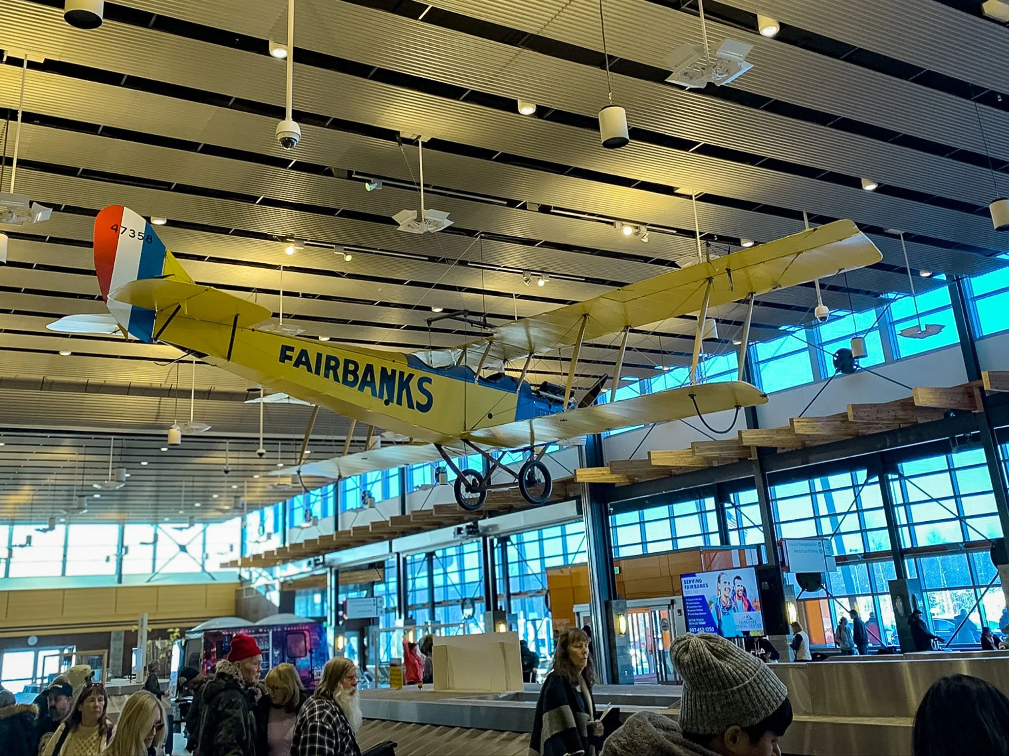 Travelers wait for their luggage at a baggage carousel at Fairbanks International Airport in early 2020.