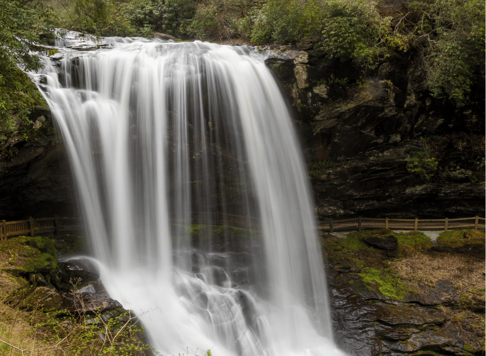 A walking path passes behind Dry Falls, a 75-foot waterfall in Highlands, North Carolina.