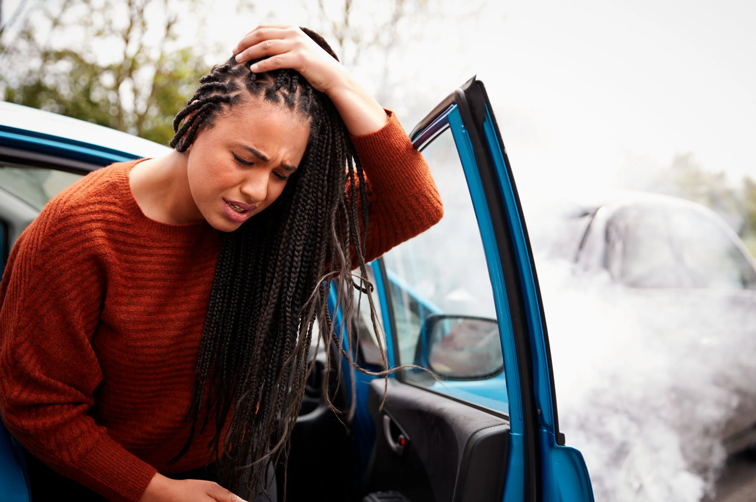 female-motorist-with-head-injury-getting-out-of-ca-2021-08-26-16-13-16-utc.jpg