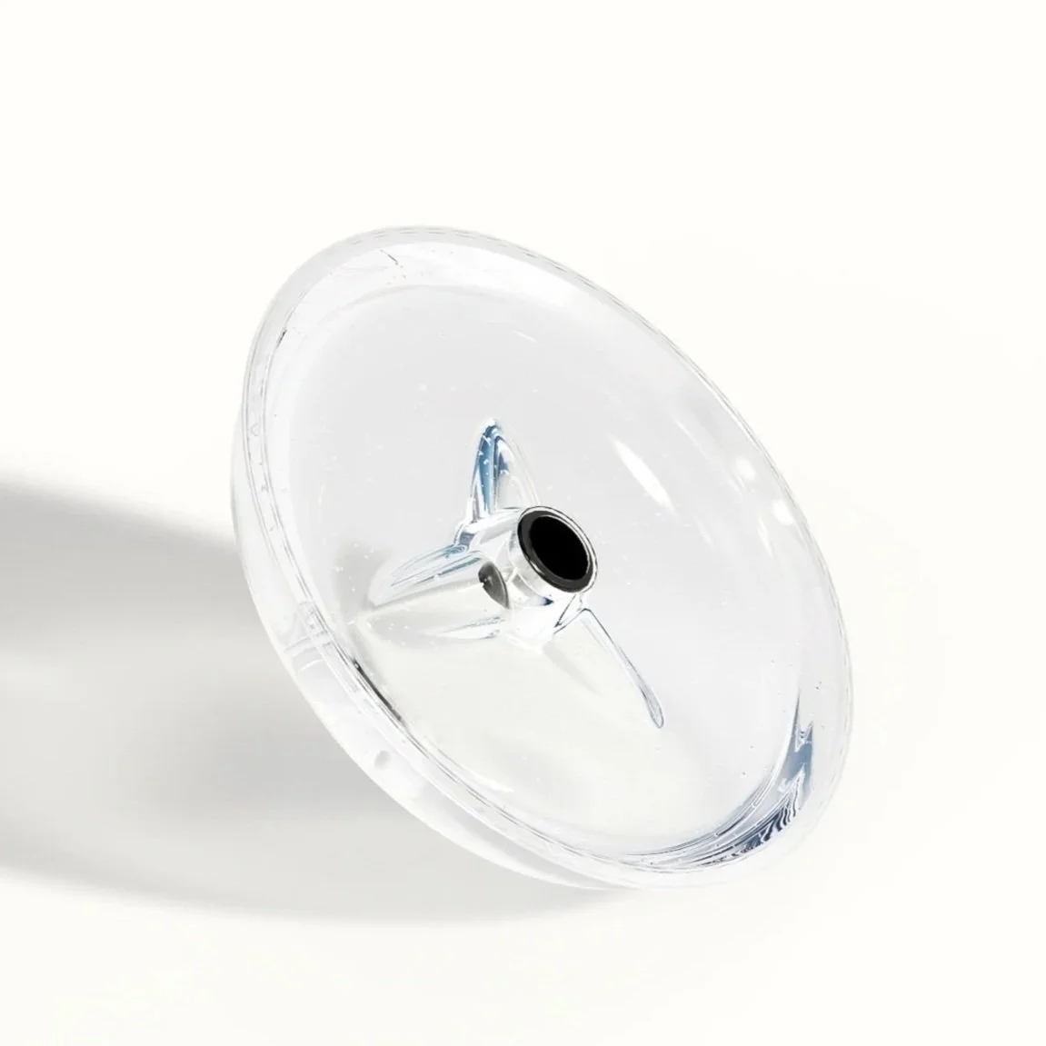 The Ant-Mote clear polycarbonate ant moat dish photographed on a white background