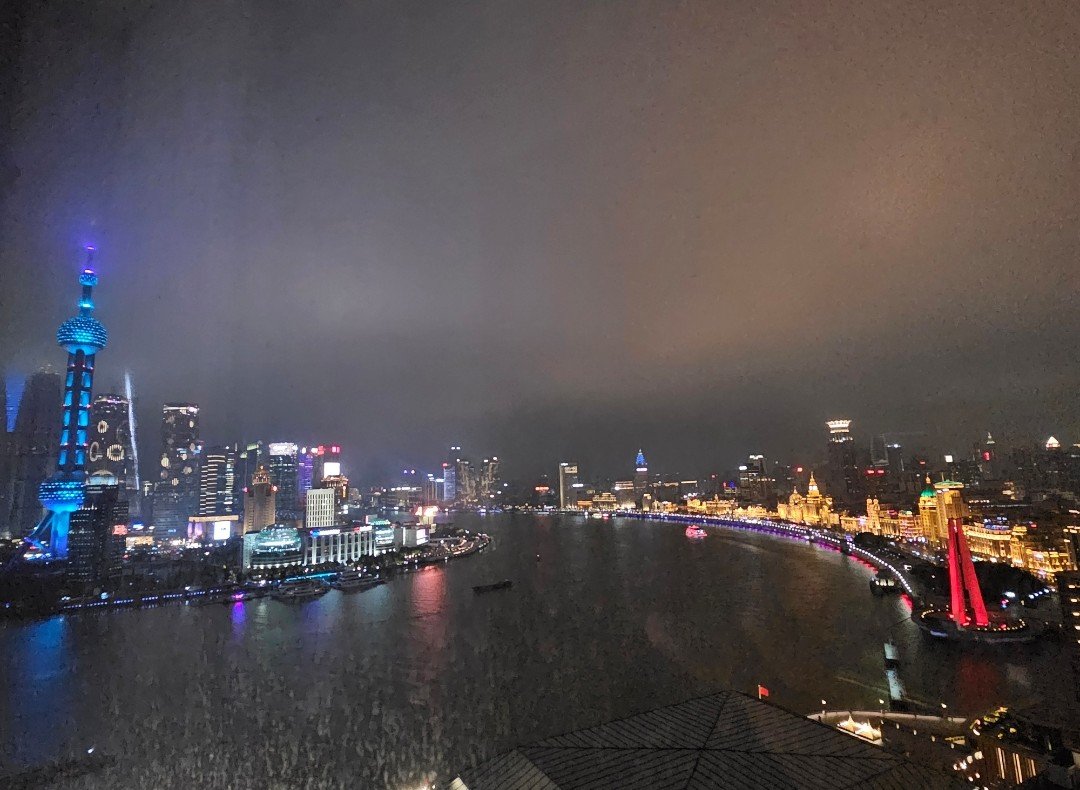 evening view of the Shanghai skyline with the lights of the city on